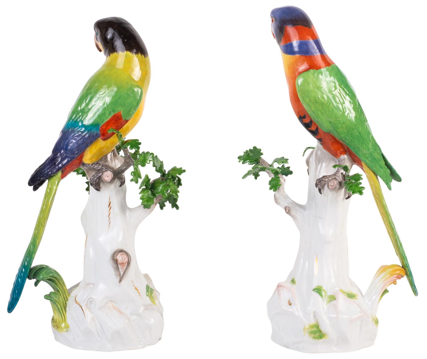 A good quality pair of 19th century German Meissen porcelain parrots, each with wonderful bold colors and perched on a tree trunk, with branches of leaves coming off them.
Blue crossed swords signed to the bases.
