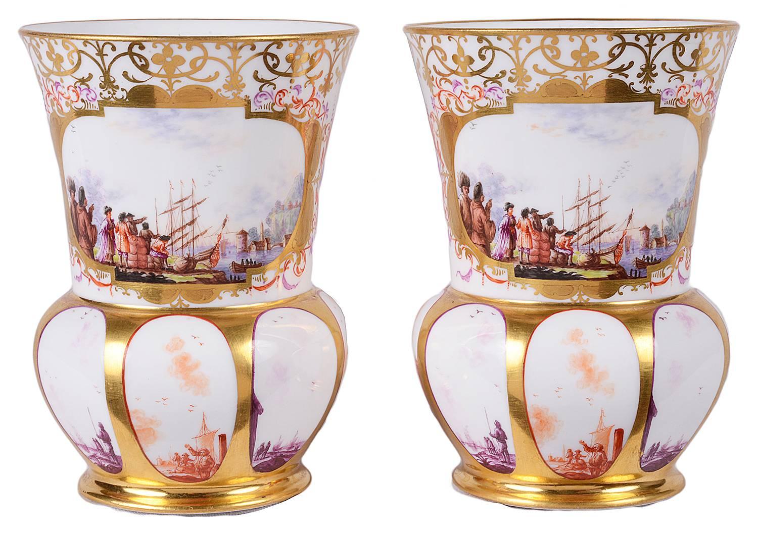 A good quality pair of 19th century Meissen porcelain vases. Each having gilded scrolling decoration with inset painted panels depicting harbour scenes.
Blue crossed swords to base.