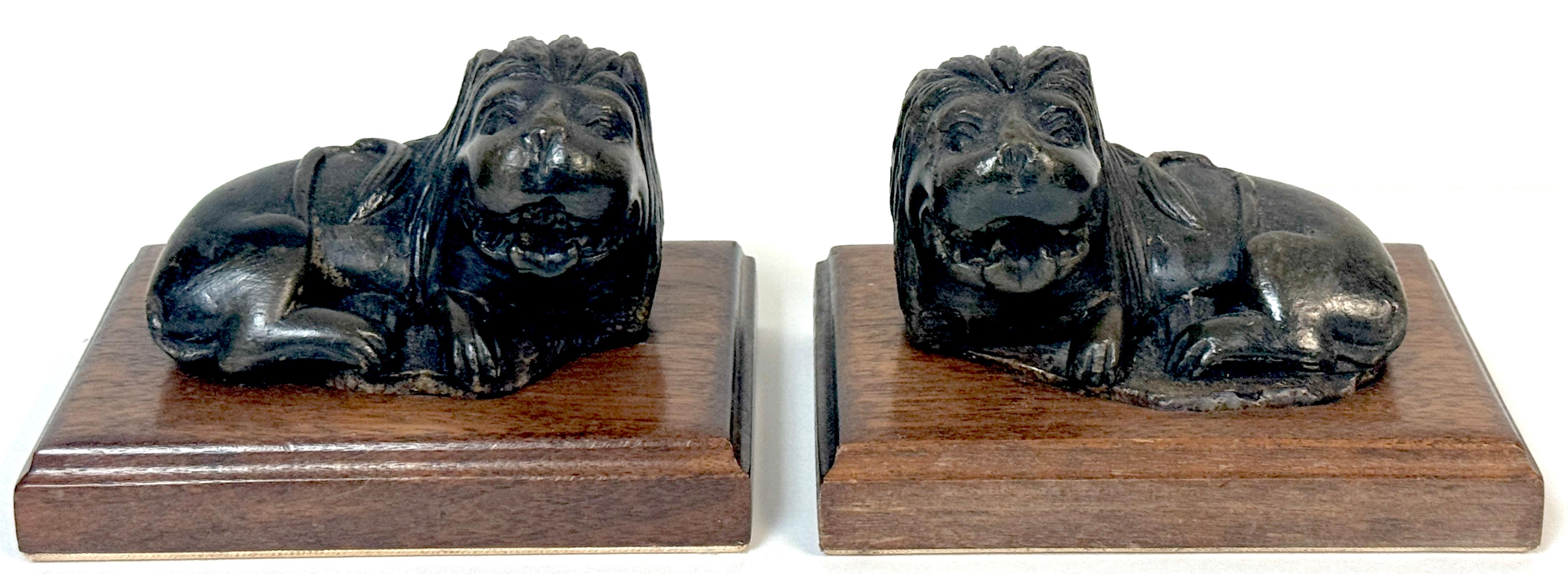 Pair of 19th Century or Older Indian Carved Stone Lions on Custom Wooden Bases
4 Pieces, Stone Lions, 2 Custom Hardwood Bases

A charming and unusual pair of 19th century or older hand-carved stone lions, likely of Indian origin, each resting in a