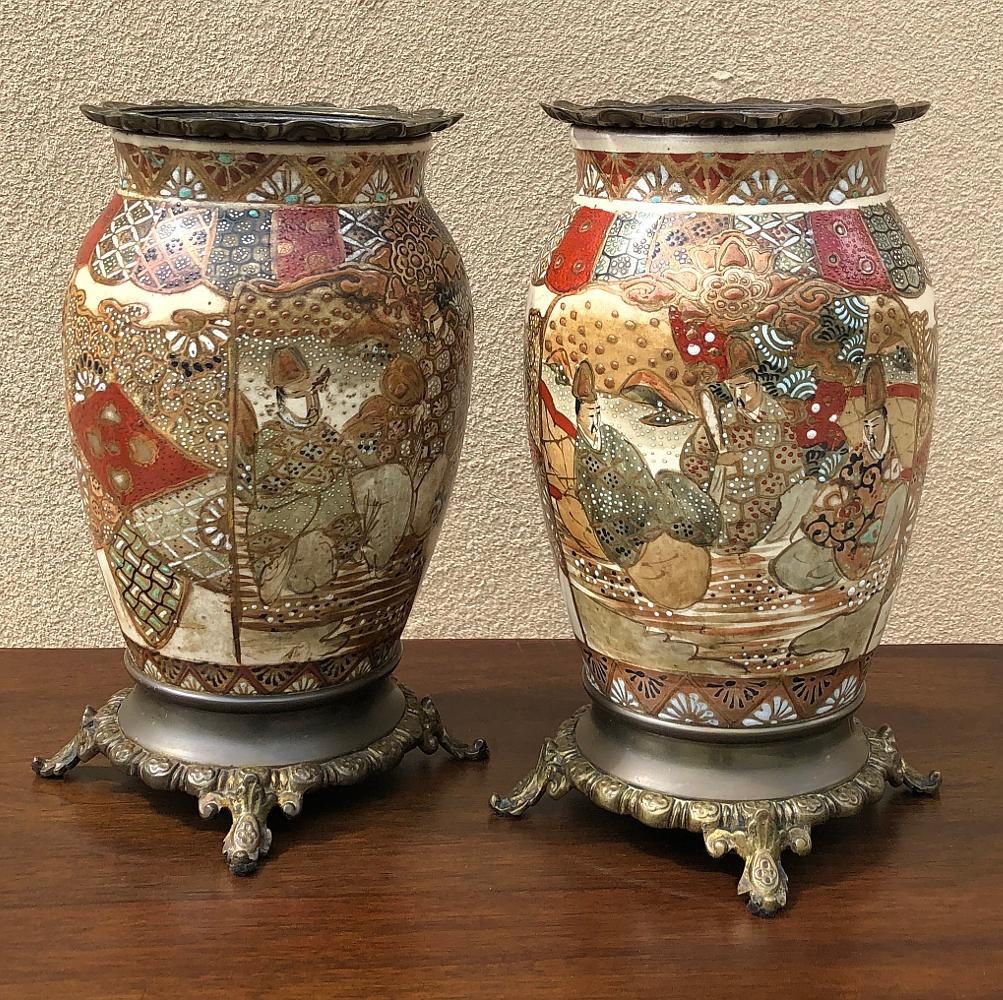 Pair of 19th century oriental Satsuma vases were hand-painted on the finest Japanese porcelain then set on cast bronze bases for the ultimate in Oriental Opulence! An intricate 