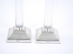 Pareja de candeleros portugueses del siglo XIX plateados y con forma de columna de cristal