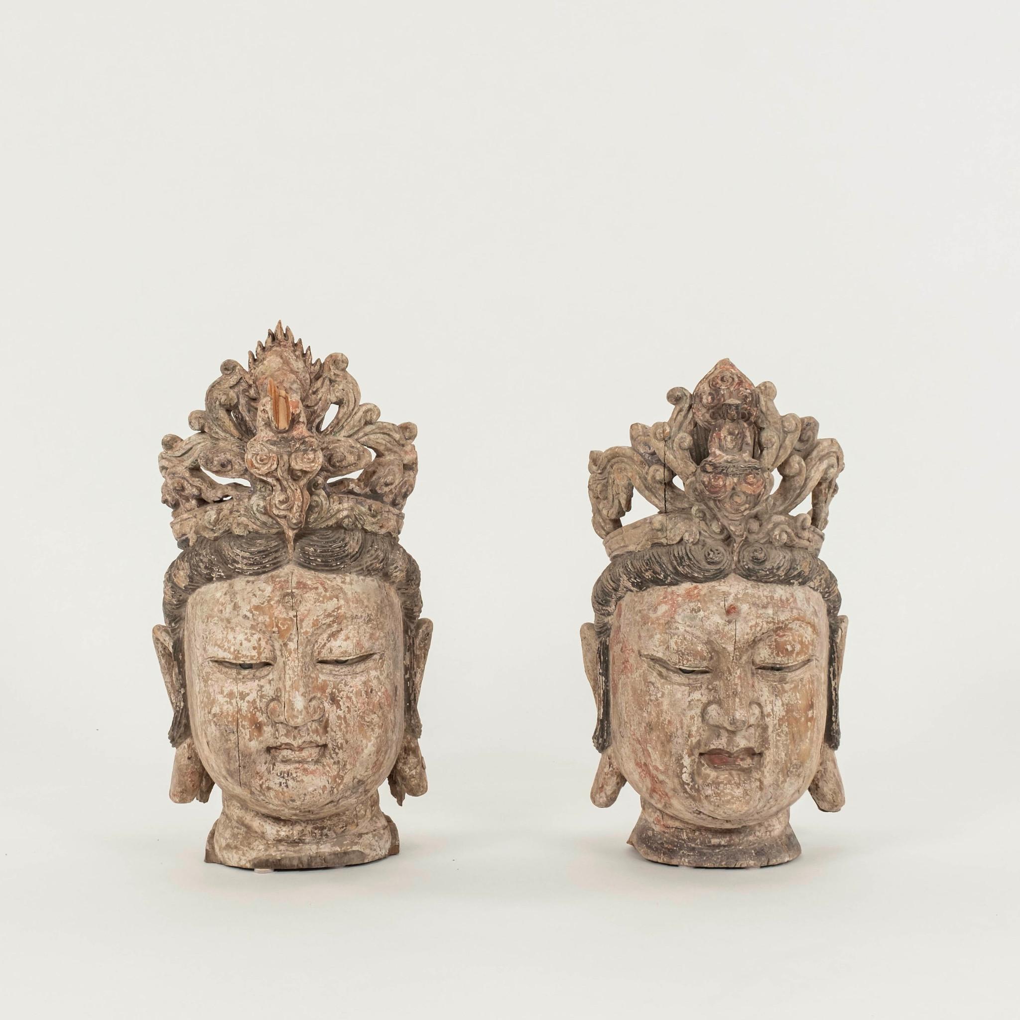 Pair of 20th Century or earlier  polychrome hand carved Guanyin Bodhisattva heads with glass eyes.