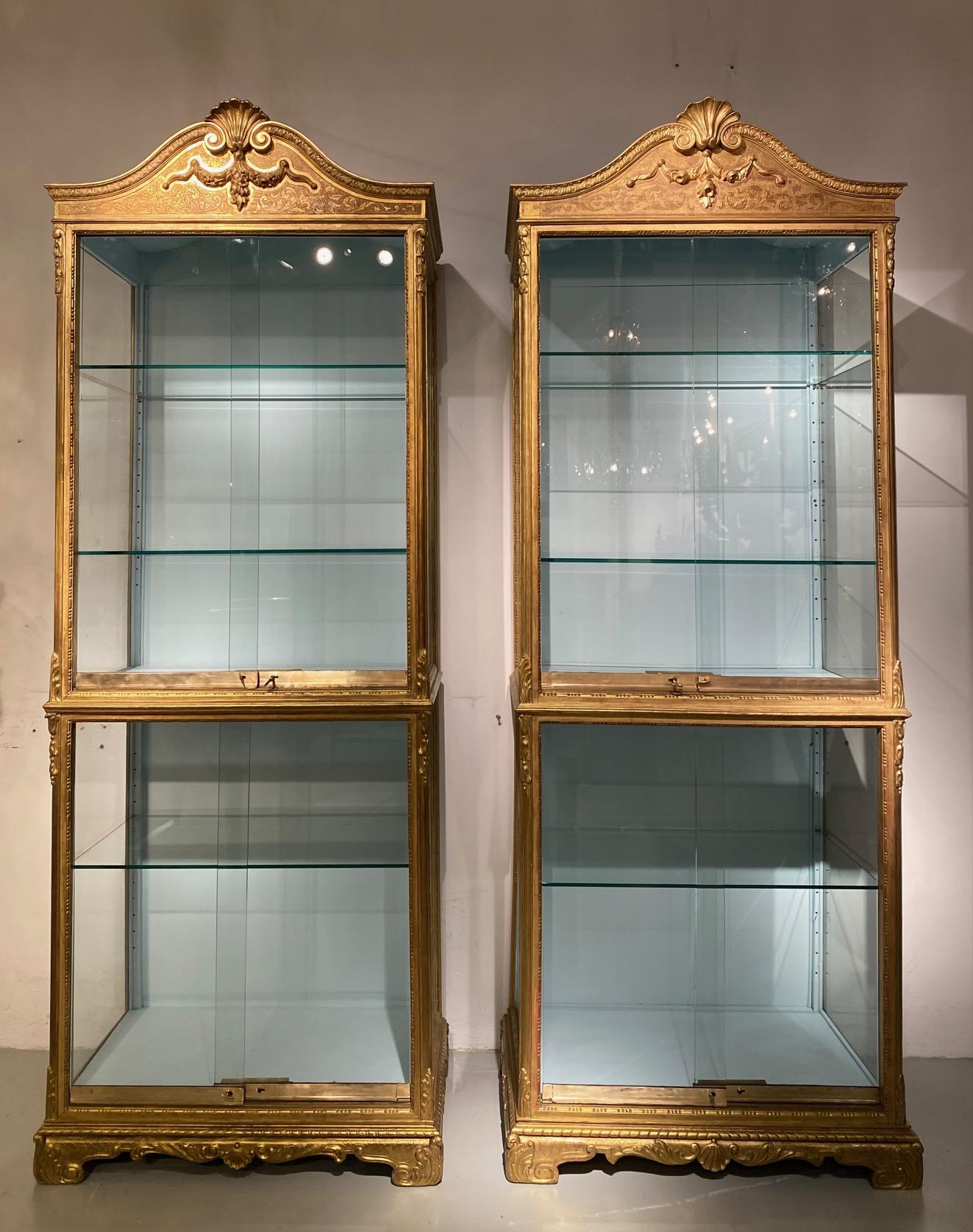 Regency Pair 19th century  Regence style vitrines in gilded wood. in vendita