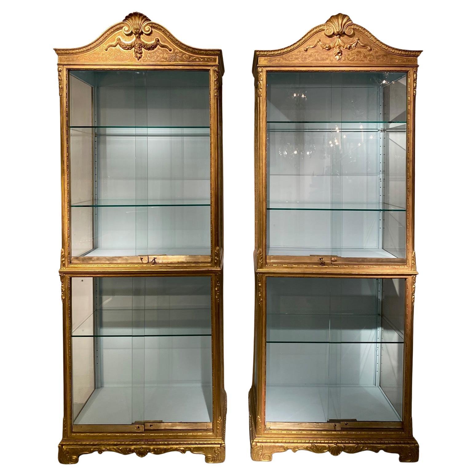 Pair 19th century  Regence style vitrines in gilded wood. in vendita