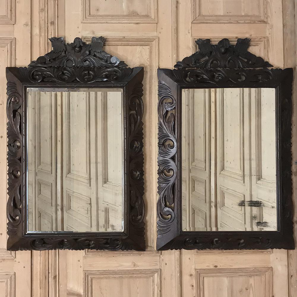 Pair 19th century Renaissance carved wood mirrors are a rare find, with hand carved oak frames, a masculine touch, and a size that makes them a perfect choice for the bathroom or anywhere a little symmetry is desired,
circa 1890s
Each measures