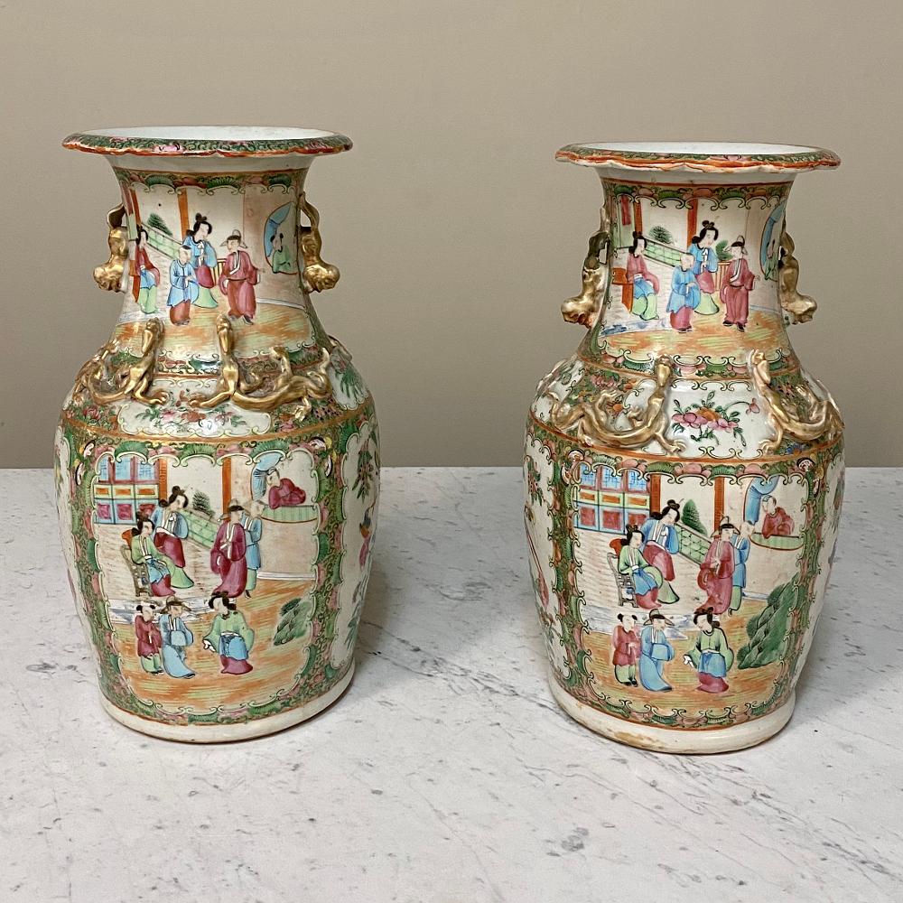 Pair of 19th century Rose Medallion vases are a truly rare find in this condition, with the bold coloration remarkably well preserved thanks to the proprietary hand-painting and glazing techniques of the master porcelain artisans of the period. Rose