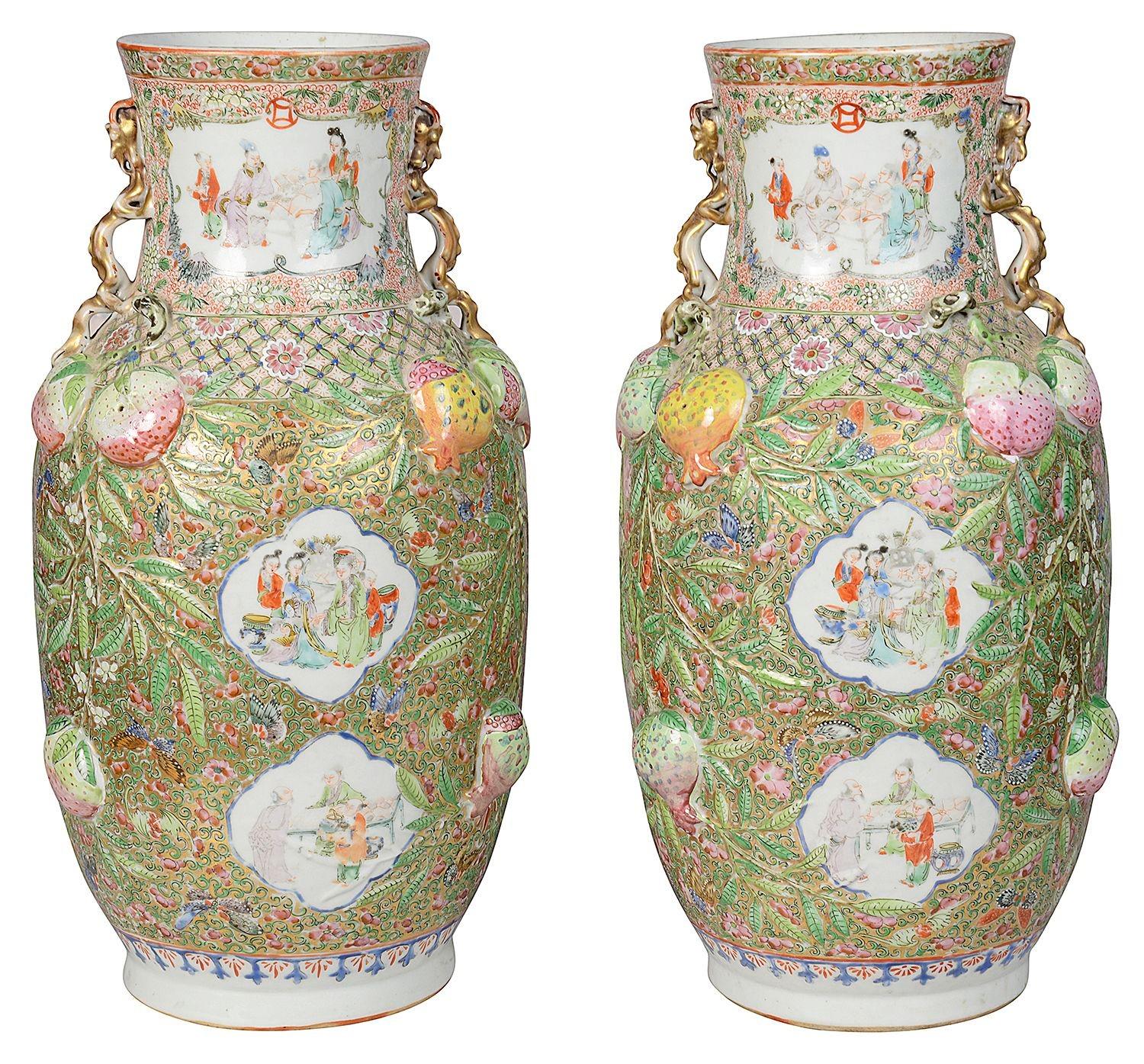 An unusual and rare pair of 19th Century Chinese Rose Medallion porcelain vases / lamps. Each with wonderful raised decoration, depicting exotic flowers, fruit, butterflies and classical motifs. The inset hand painted panels of various courtiers,