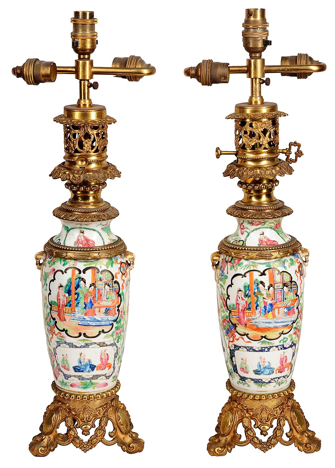 A pair of 19th century Chinese Cantonese / rose medallion vases / lamps. Each with wonderful green ground decoration with inset hand painted panels depicting classical scenes with Geisha girls, courtiers and children, gilded ormolu mounts and bases.
