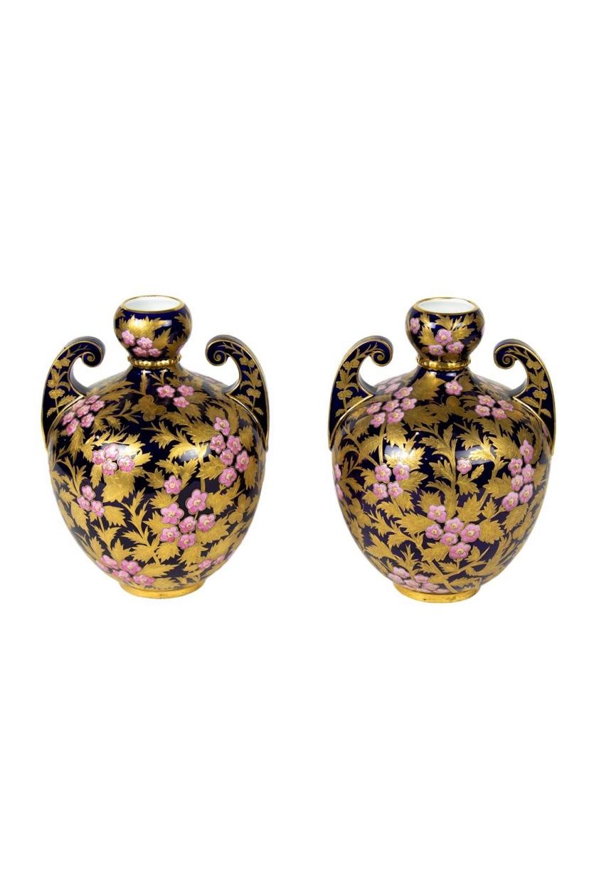 A pair of Royal Crown Derby England vases that is one of their largest sizes in this shape. Rich cobalt blue ground (not black) and heavily raised enamel pink chrysanthemums decorate the vases completely. Finished with lots of 24 karat gilding