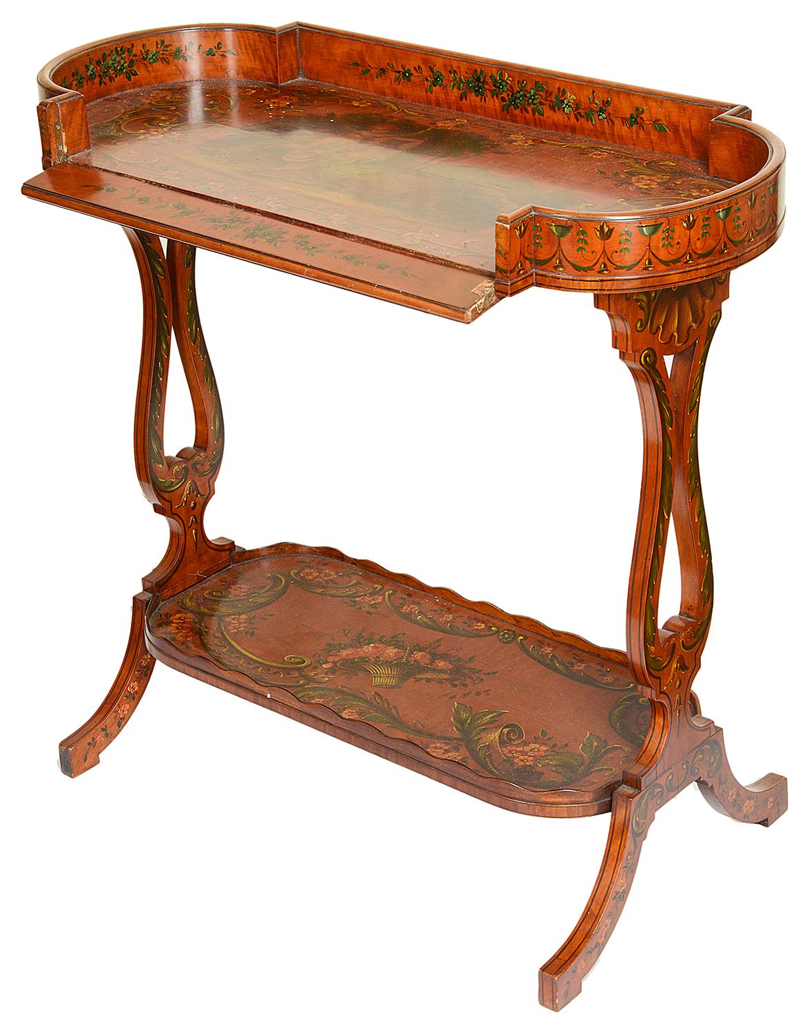 A good quality pair of Sheraton revival satinwood two-tier side tables, each with painted decoration, depicting classical maidens, cherubs, flowers and foliage, the lyre shaped end supports and drop sides, raised on out swept legs.