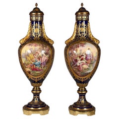 Antique Pair 19th Century Sevres style lidded vases.
