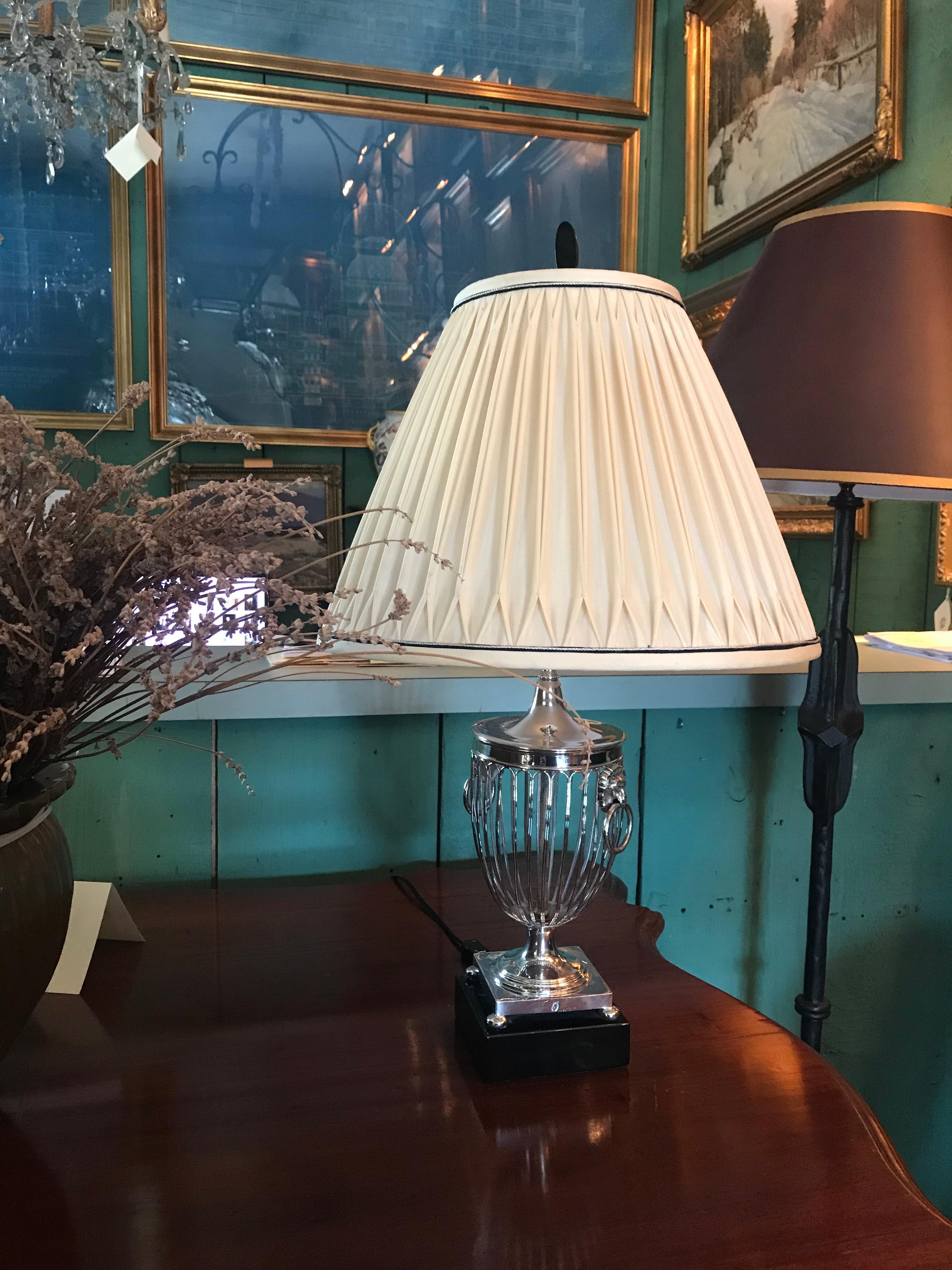 Very elegant 19th century silver plated Basket urns turned into a beautiful pair of table lamps.
The perfect light on a console,  side table  or an enfilade in an entrance . if you need extra 
light source in your library living or dining room ,