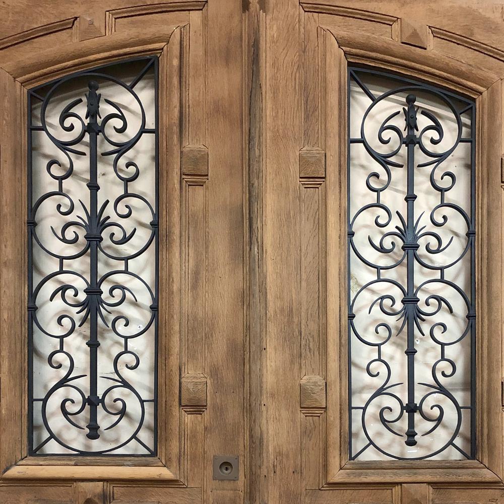 Pair of 19th Century Solid Oak Doors with Wrought Iron Inserts In Good Condition In Dallas, TX