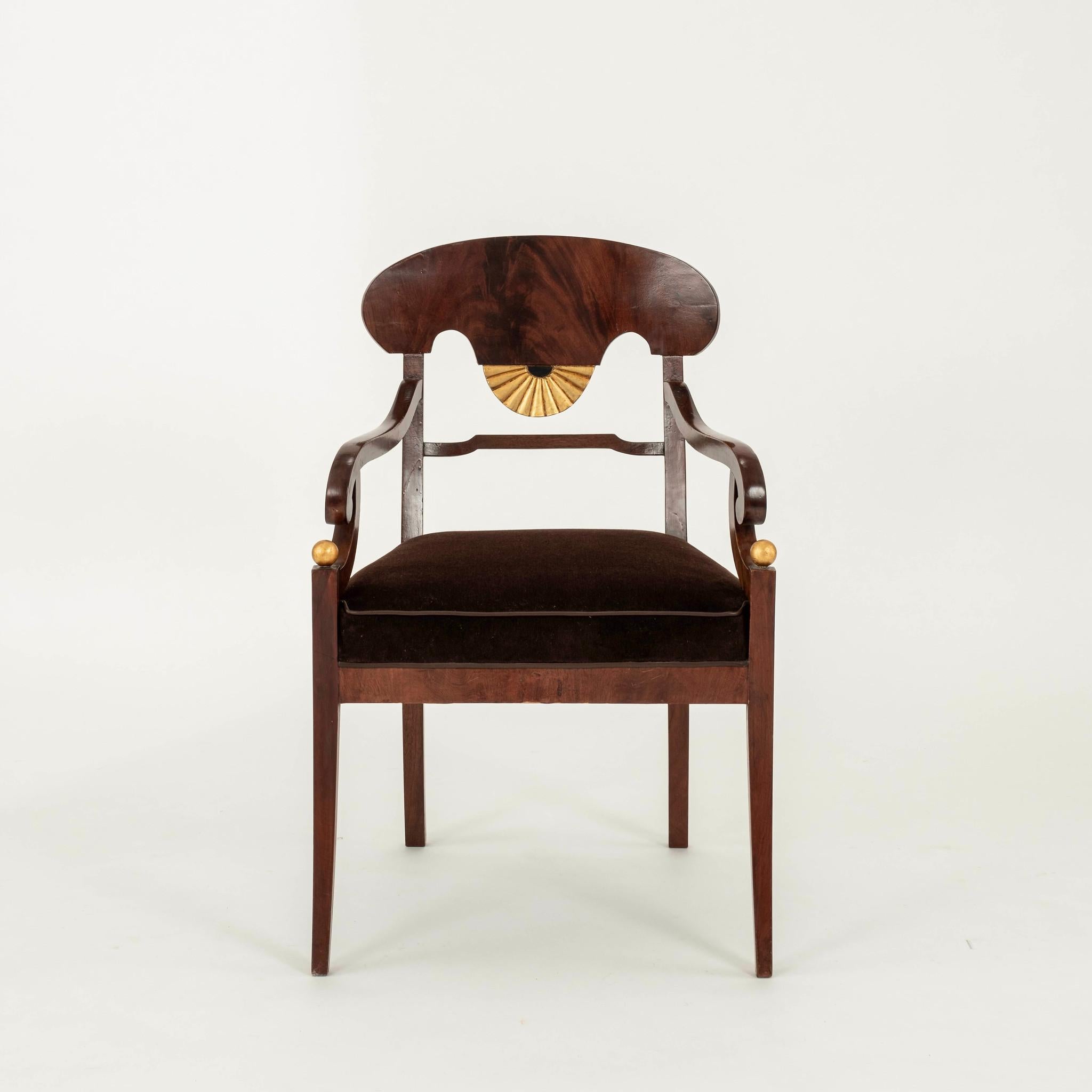 Pair of period Swedish  Biedermeier armchairs: handsome mahogany hardwoods with gilded accents newly upholstered in chocolate mohair with leather trim.