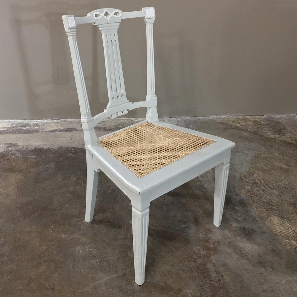Pair of 19th century Swedish Louis XVI painted and caned chairs is the perfect choice for a cozy nook or seating group (especially with the original matching salon pieces)! Timeless styling is enhanced by the painted off-white finish which has