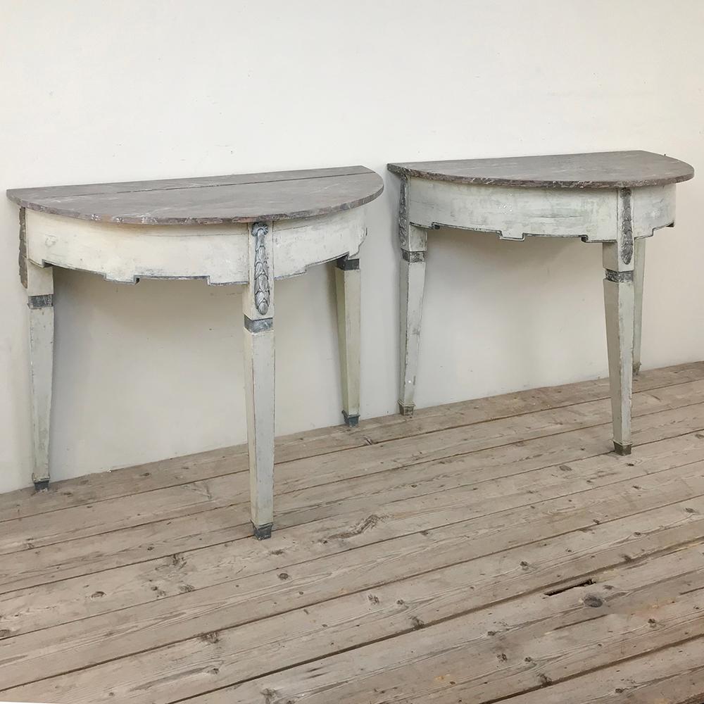 Pair of 19th century Swedish painted demilune consoles represent the essence of the style, with tailored architecture and a patinaed painted finish in two tones for a pleasing visual effect. Three legged design means they do not have to be mounted