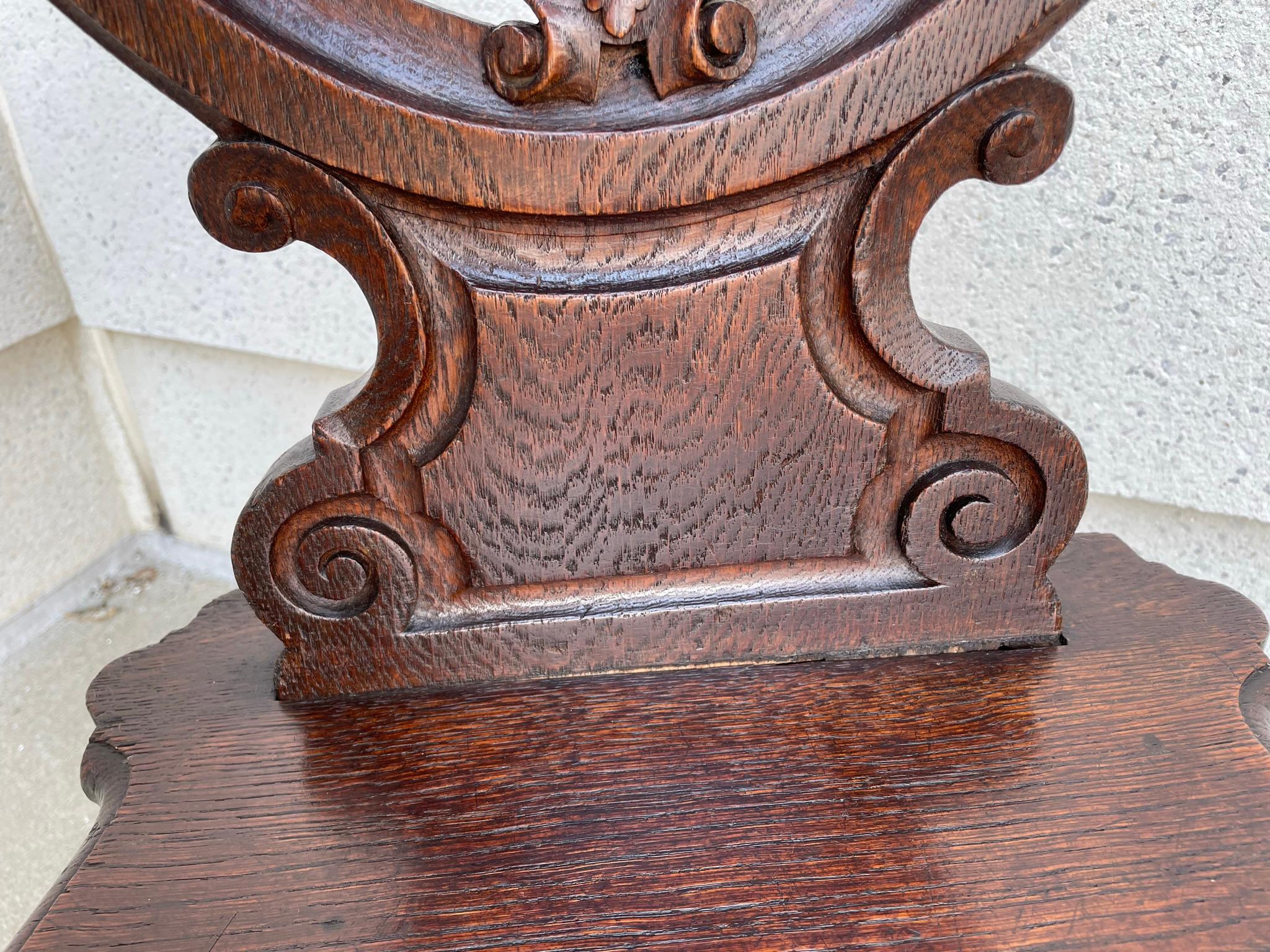 Pair 19th Century Swiss Black Forest Carved Oak Side Chairs In Good Condition In Stamford, CT