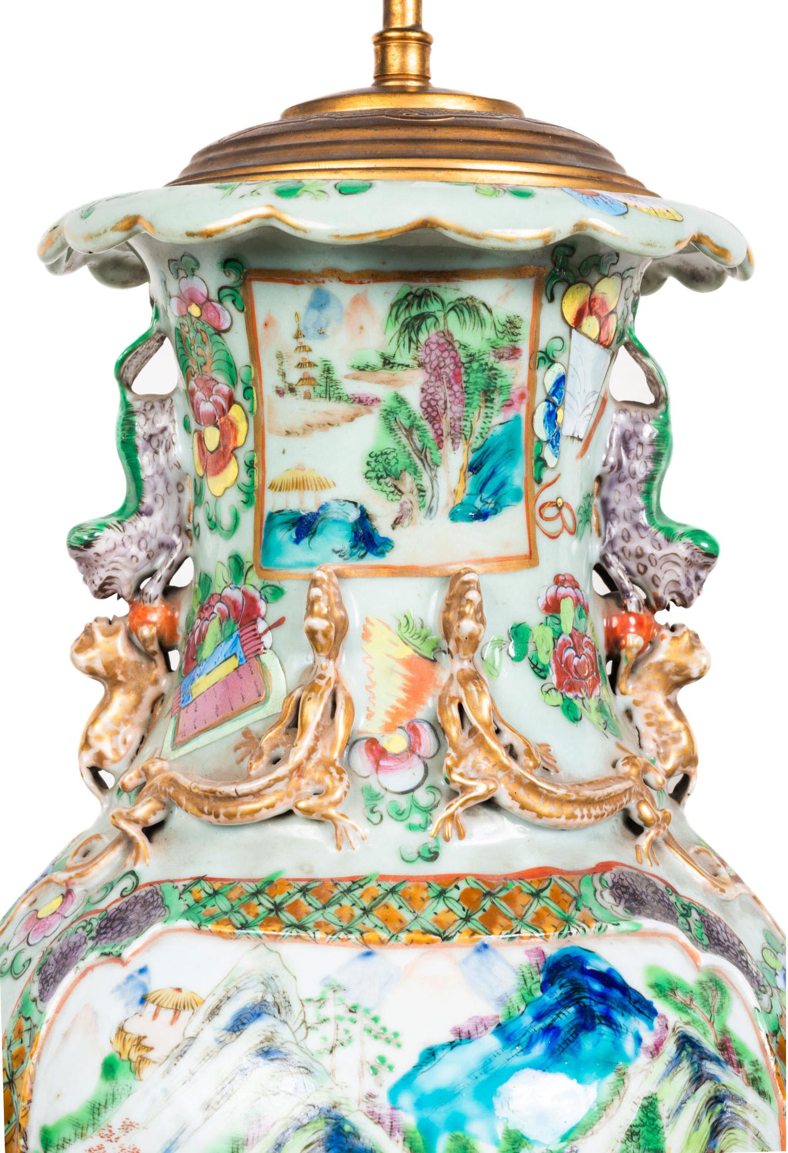 A wonderful quality pair of mid 19th century Chinese Cantonese / Rose medallion vases / lamps, each with bold colours, exotic flowers, butterflies and motifs. Inset painted panels depicting mountainous and lakeside scenes. Mounted on gilded ormolu