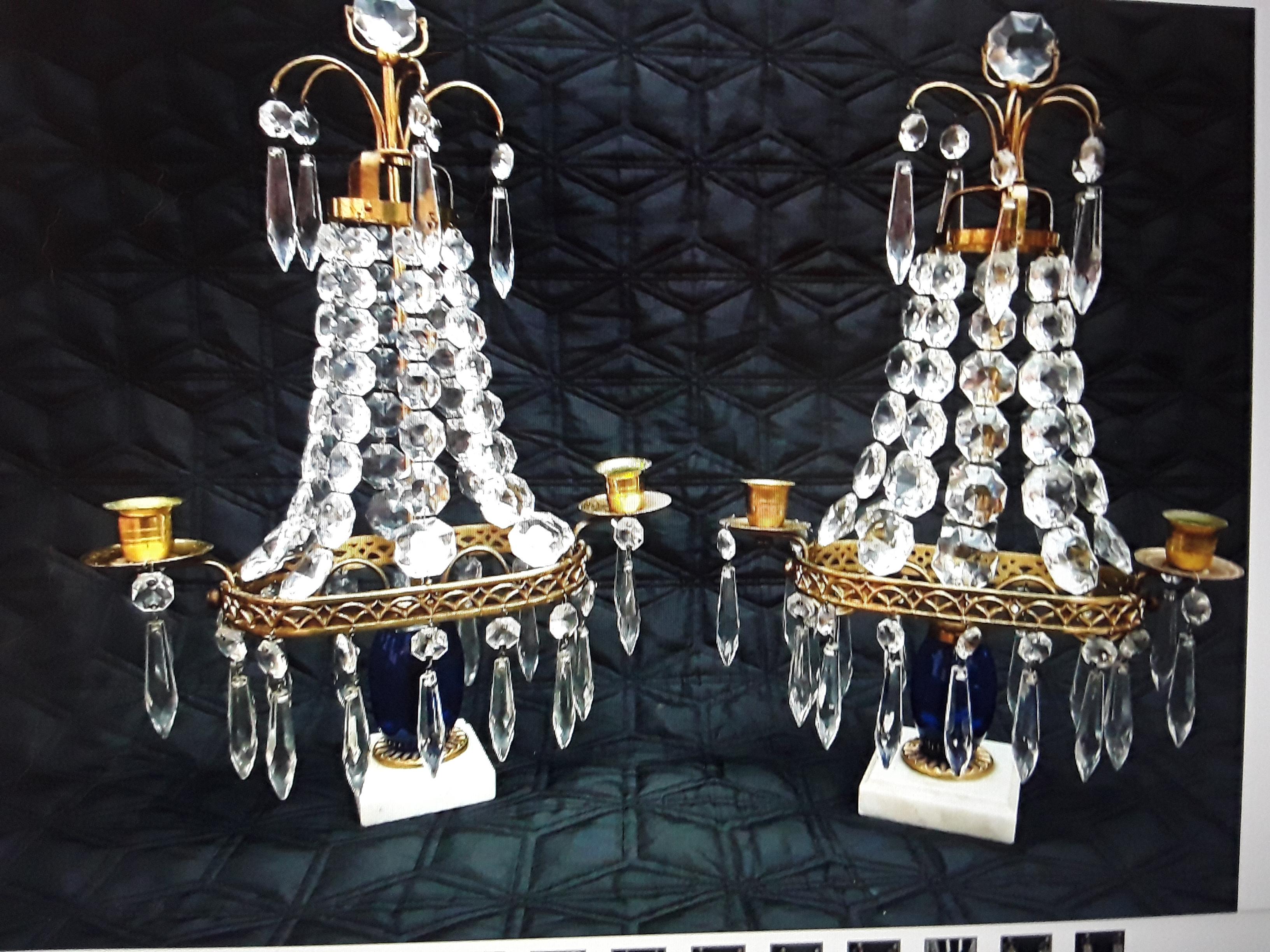 This pair is unique for  sure! Marble plinth with a blue art glass cylinders issuing cut Crystal Chains in Descending sizes. Brass filigree bordered. The whole is absolutely beaautiful in its unelectrified original state.