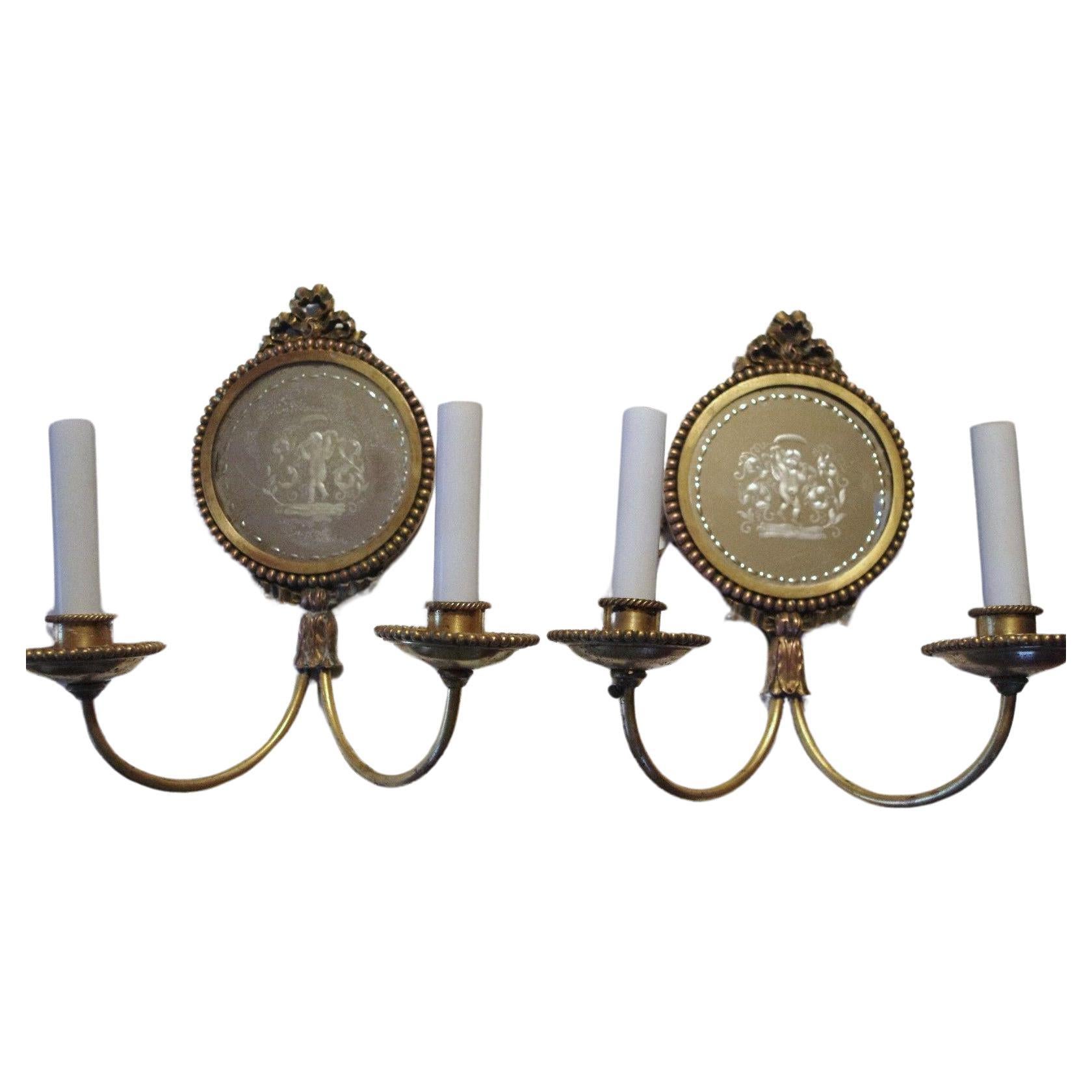 Neoclassical Pair 19thc Neoclassic Bronzw/Eglomise Cherubs Cavorting Wall Sconces by Caldwell For Sale