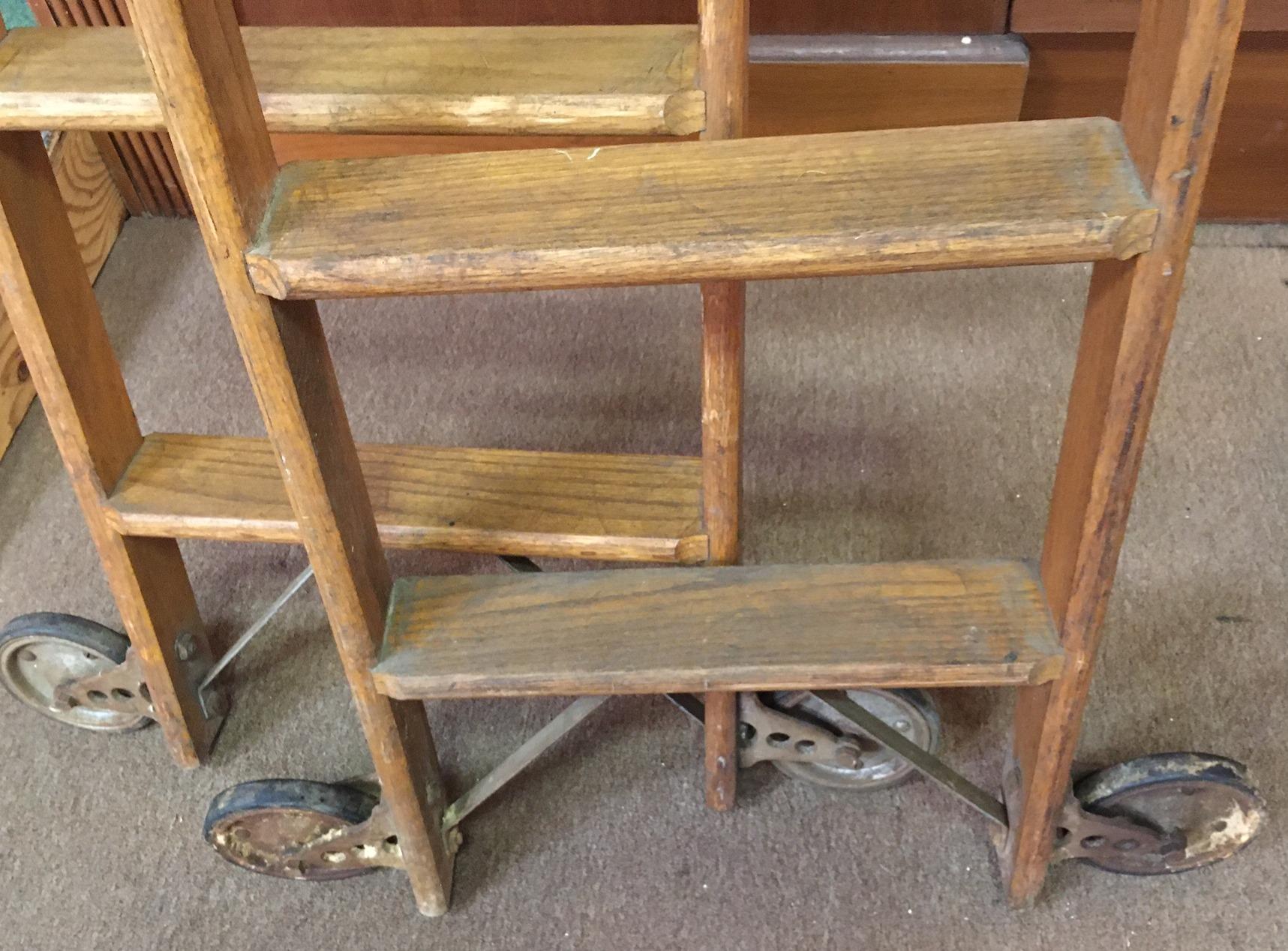 Pair 19thc Tall Haberdashery Tall Rolling Industrial Solid Oak Ladders In Good Condition For Sale In Savannah, GA