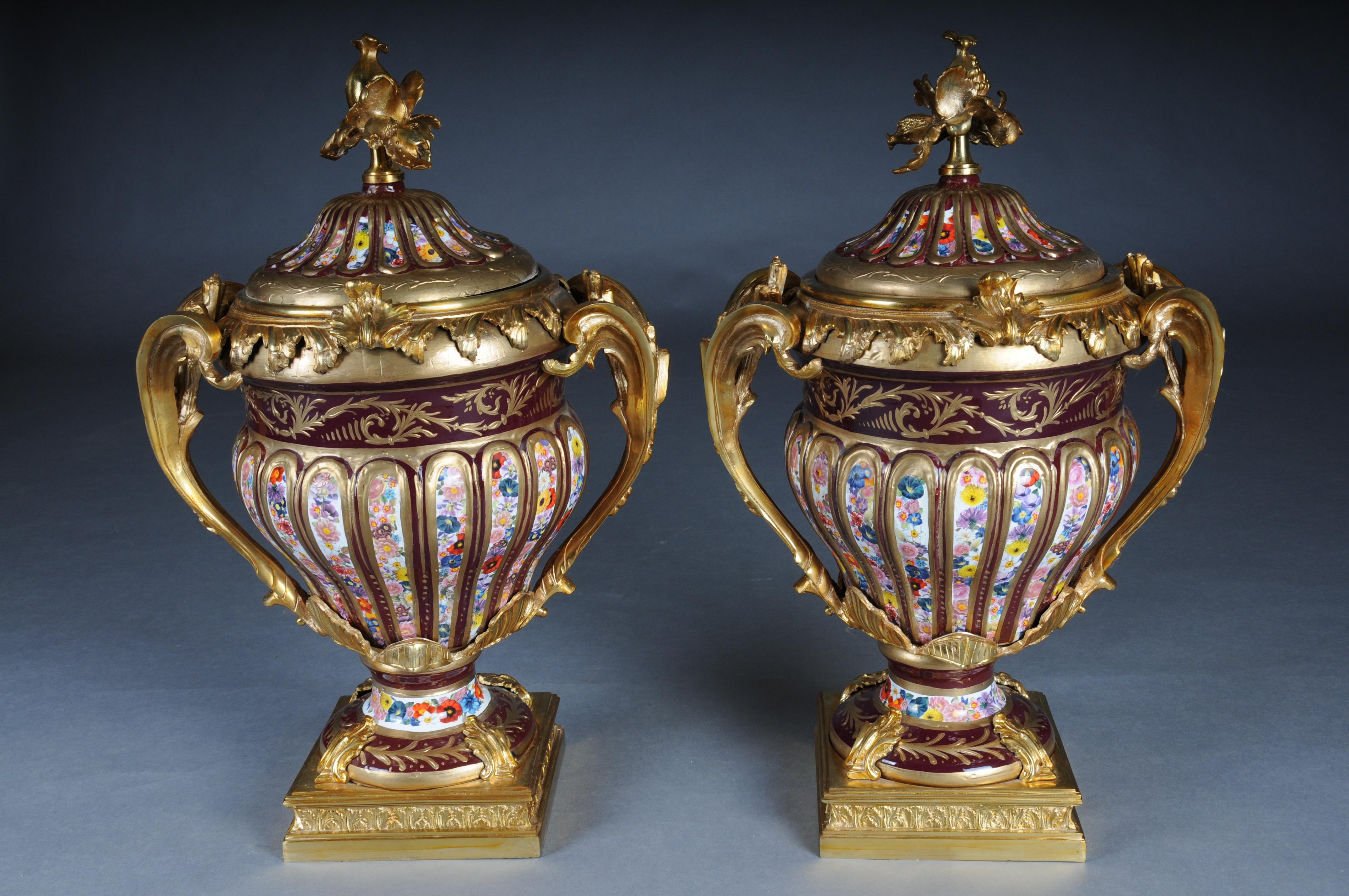 Pair (2) Magnificent and Decorative Gold Lidded Vases

Brass lidded vases with colorful stoneware porcelain. Richly decorated with curved handles on square, tiered bases.

Enrich your interior with our handcrafted vases, an artful ensemble that adds