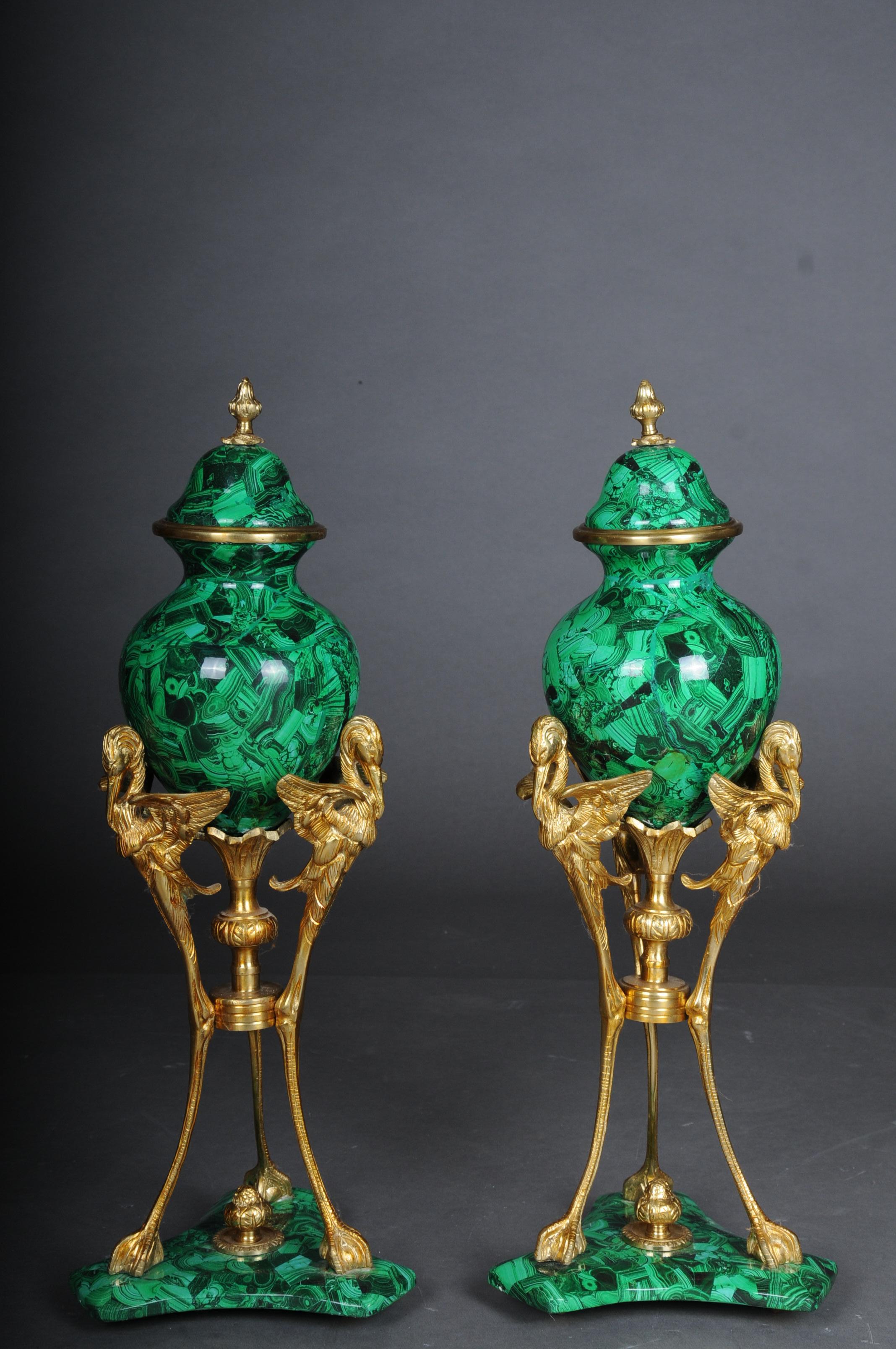 A pair of impressive table vases with malachite and brass

Expressive and decorative table vase with lid and gilded brass fittings. Vases and base in malachite finish.

Malachite look may vary slightly from pictures.

The two vases are made