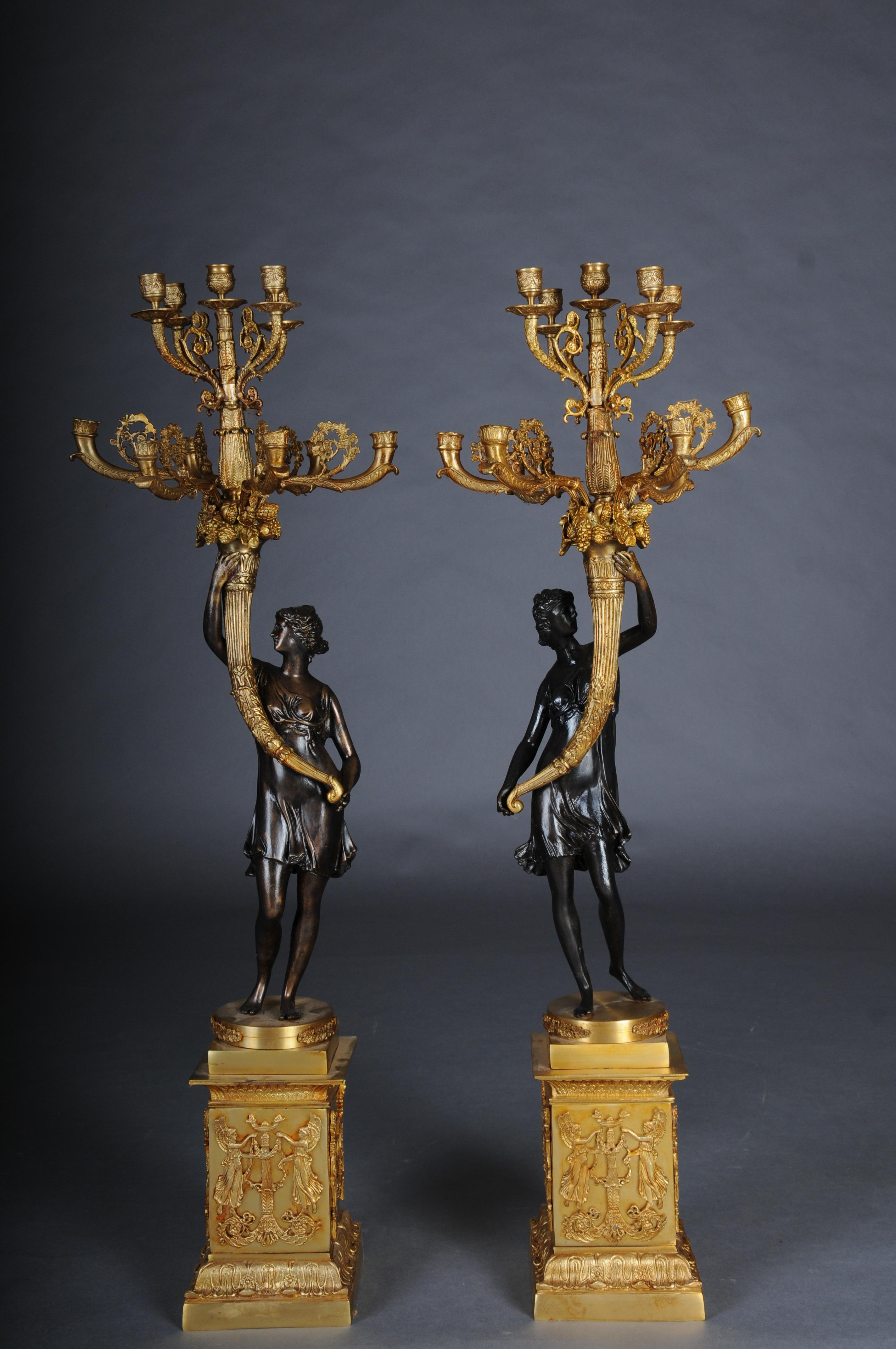 Pair (2) of magnificent French candelabra made of gilt brass bronze and patinated bronze.

Pair of French gilt bronze and patinated bronze candelabra
French, 20th Century

A magnificent pair of 20th-century Empire-style candelabra, these striking