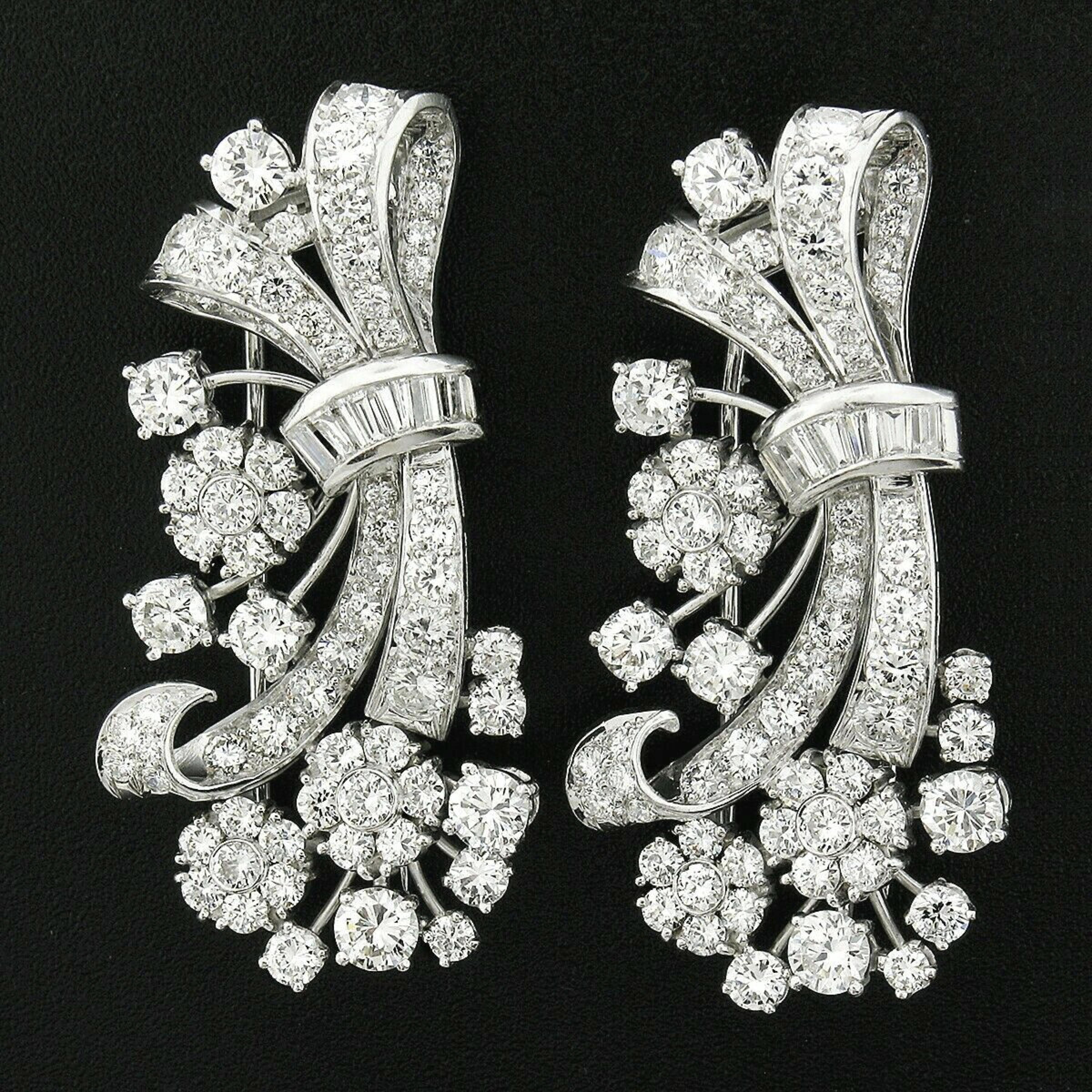 Here we have a pair of two truly breathtaking and matching vintage brooch/clips that are crafted from solid platinum and completely drenched with very fine quality diamonds that together total approximately 11.50 carats in weight. It features