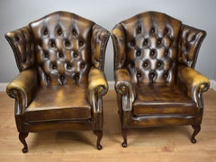 Pair of 20th Century Buttoned Back Leather Wing Back Armchairs
