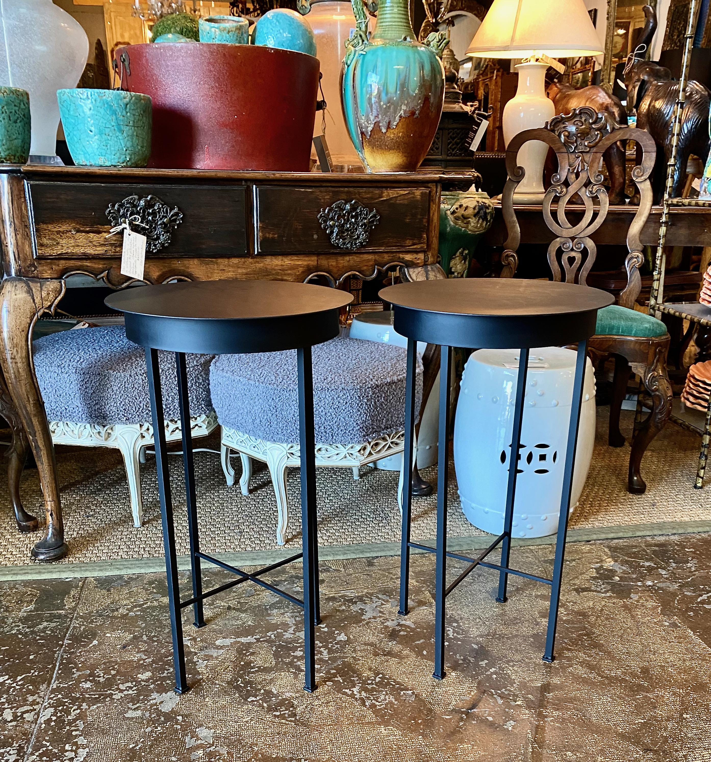 This is a chic pair of iron side tables or stands that were inspired by a pair of French tables. These charming tables are suitable for indoor, as well as outdoor use. We acquired a pair of similar vintage French tables a few months ago; they sold