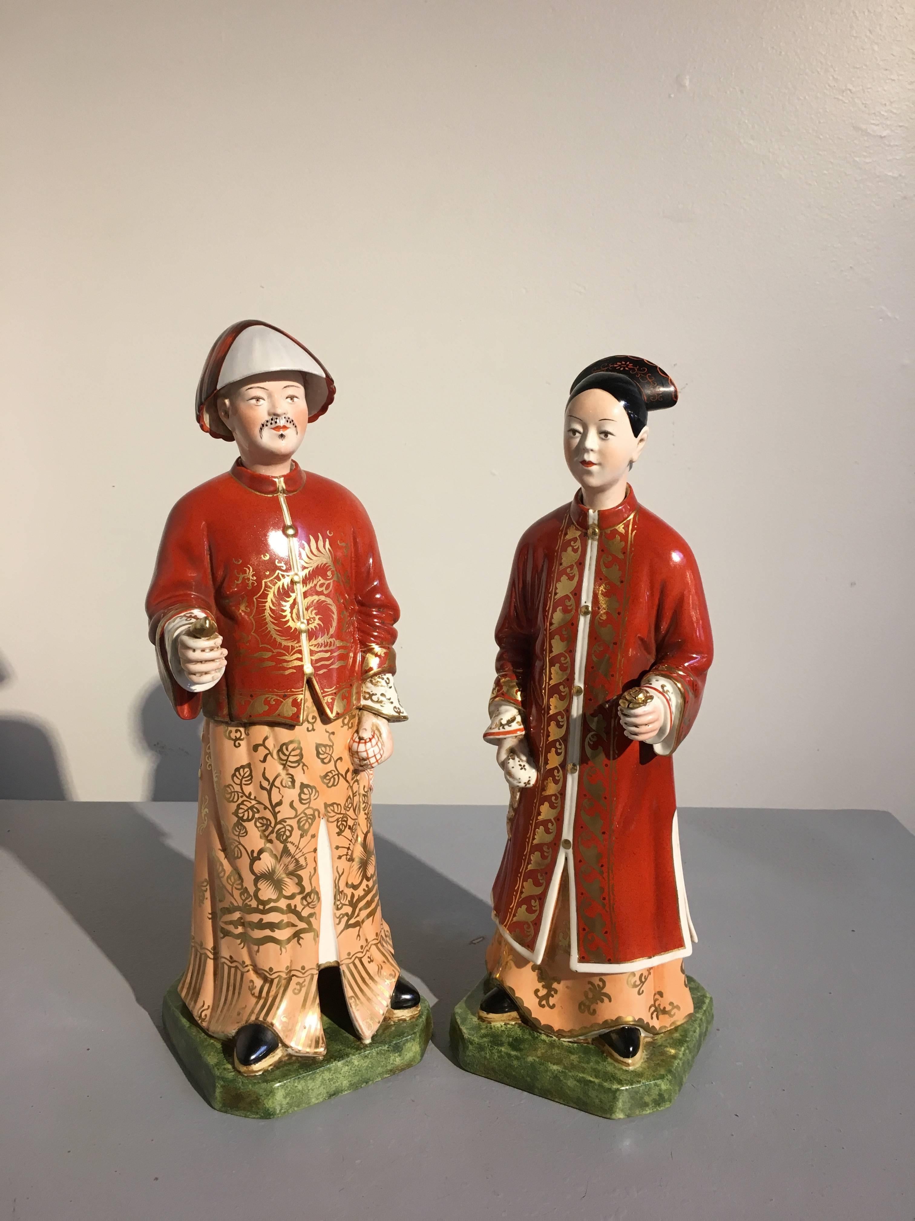 A fine pair of Italian porcelain chinoiserie nodding head figures of a Chinese Mandarin couple, made for the Marbo Lamp Company, circa 1960's, Inlay.

The charming figures portrayed standing upon short plinths and dressed elegantly in sumptuous gilt