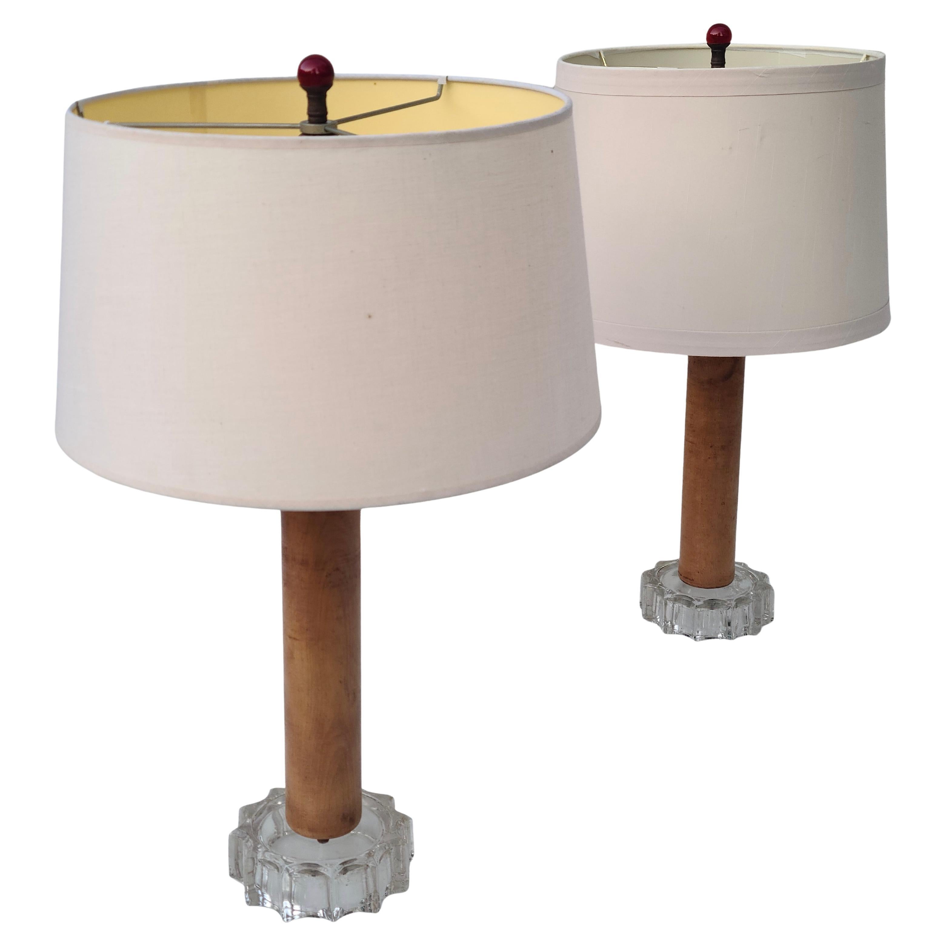 Pair Modern Lamps by Otto Guggenheim Lamp Co,
Made by Women during the war rations era of WWII.

Maplewood Cylinder on Glass base with cherry Glass finial.

During WWII many materials were rationed, but Glass
was not. Furniture showrooms across