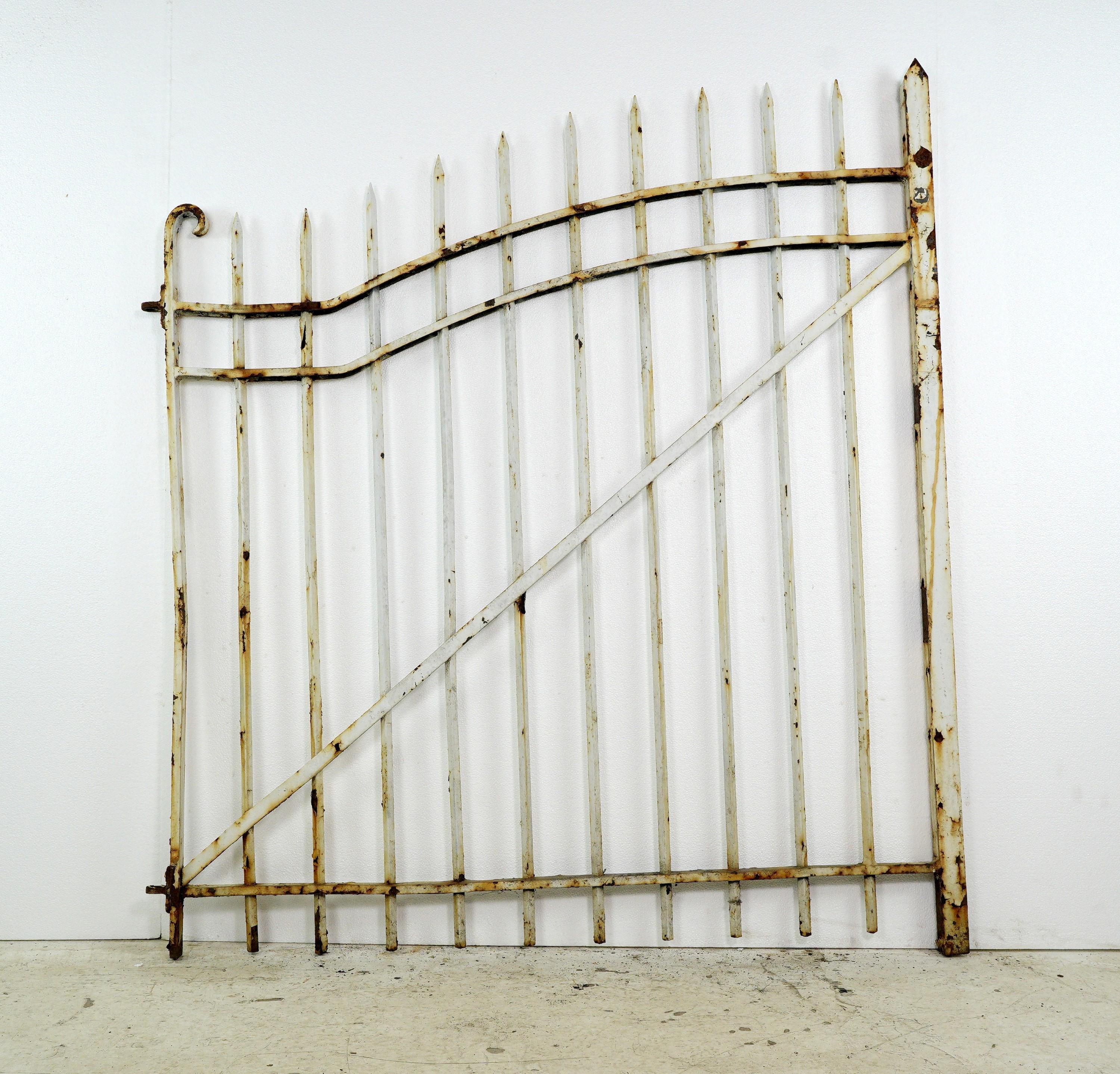 This is a great pair of heavy stock antique curved top wrought iron entry gates with curled end posts. Install them as an entrance to your property, providing privacy and security. Installation hardware will have to be sourced. They are in good