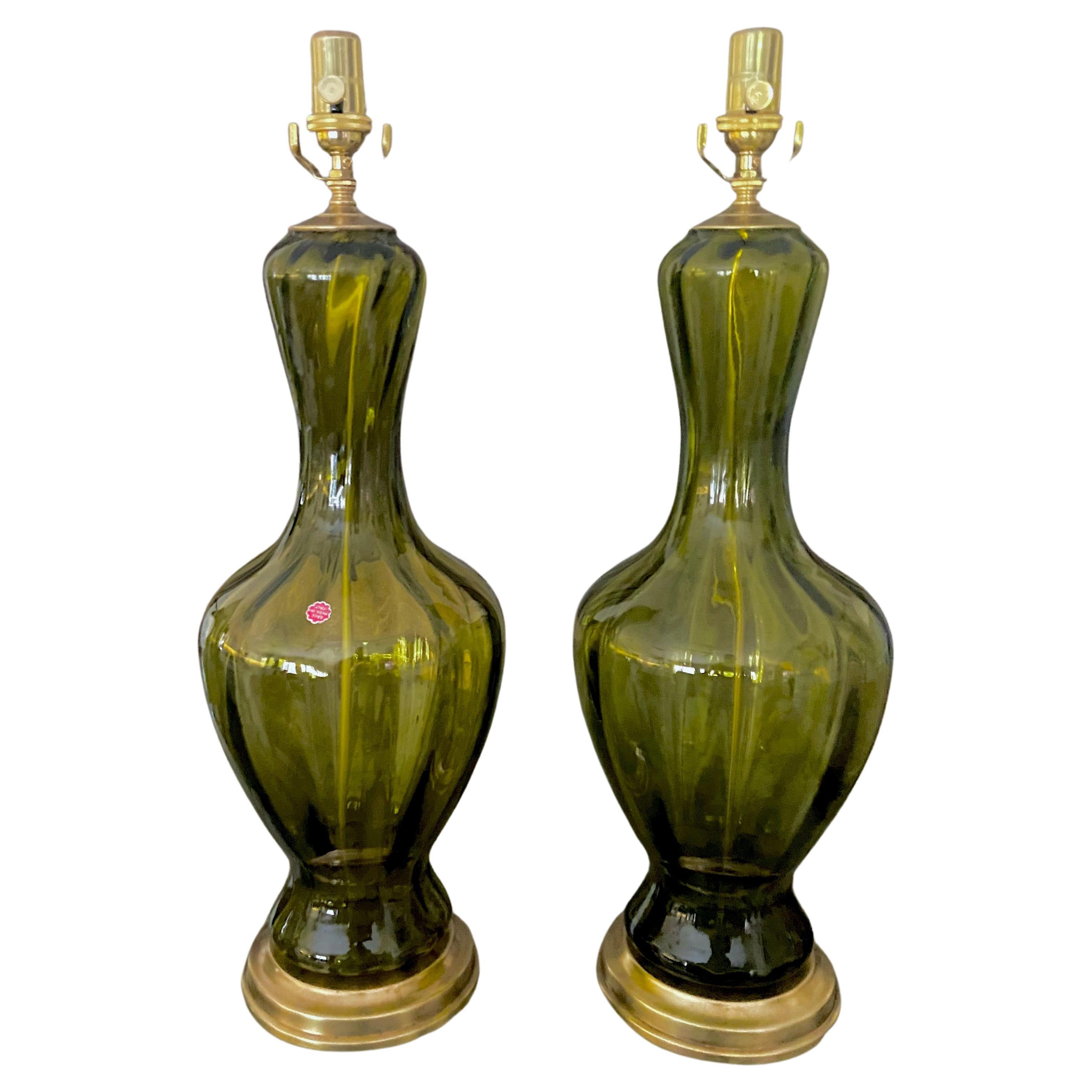 Pair of absinthe green colored Murano Venetian glass lamps on brass bases with brass fittings. Newly wired with new 3 way sockets and rayon cords.