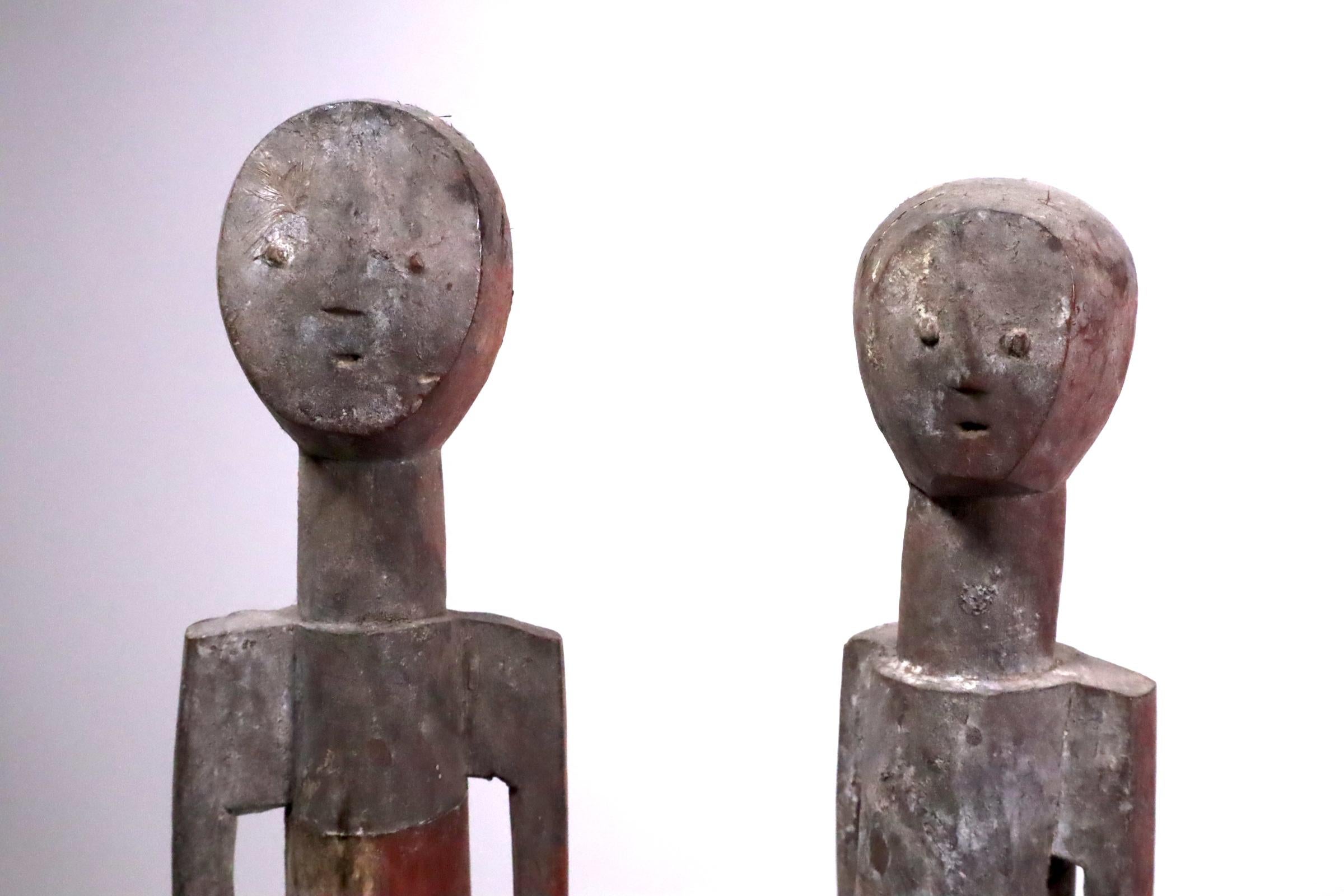 An unusually large pair with expressive faces. As a couple they interact with each other as though in a narrative or dialogue. A perfect example of how African artists are capable of capturing emotions with minimal means. The type of art that