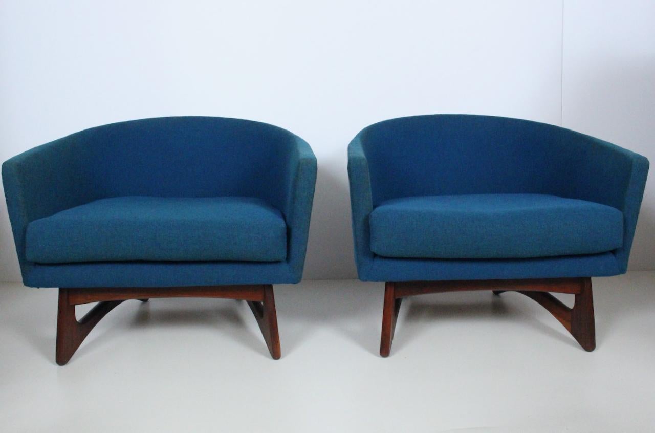 Pair of Adrian Pearsall for Craft Associates Inc. Wide Barrel Club Chairs, 1960's. Featuring a curved, comfortable low profile design, atop classic Pearsall designed smooth solid Black Walnut bases. Original woolen fabric, (Pantone 295)  with two
