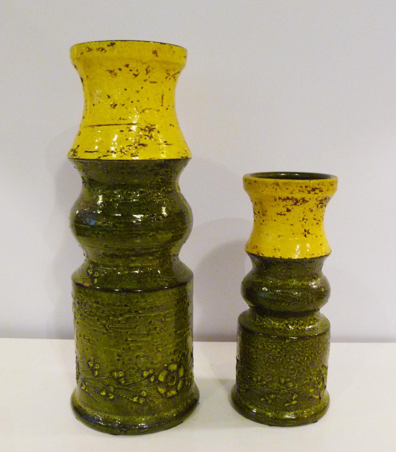 A pair of midcentury Italian Modern Bitossi textured pottery vases made for Rosenthal Netter and created by Aldo Londi. In two different sizes make a very nice decoration statement if used together. Impressed modern floral design around the bottom