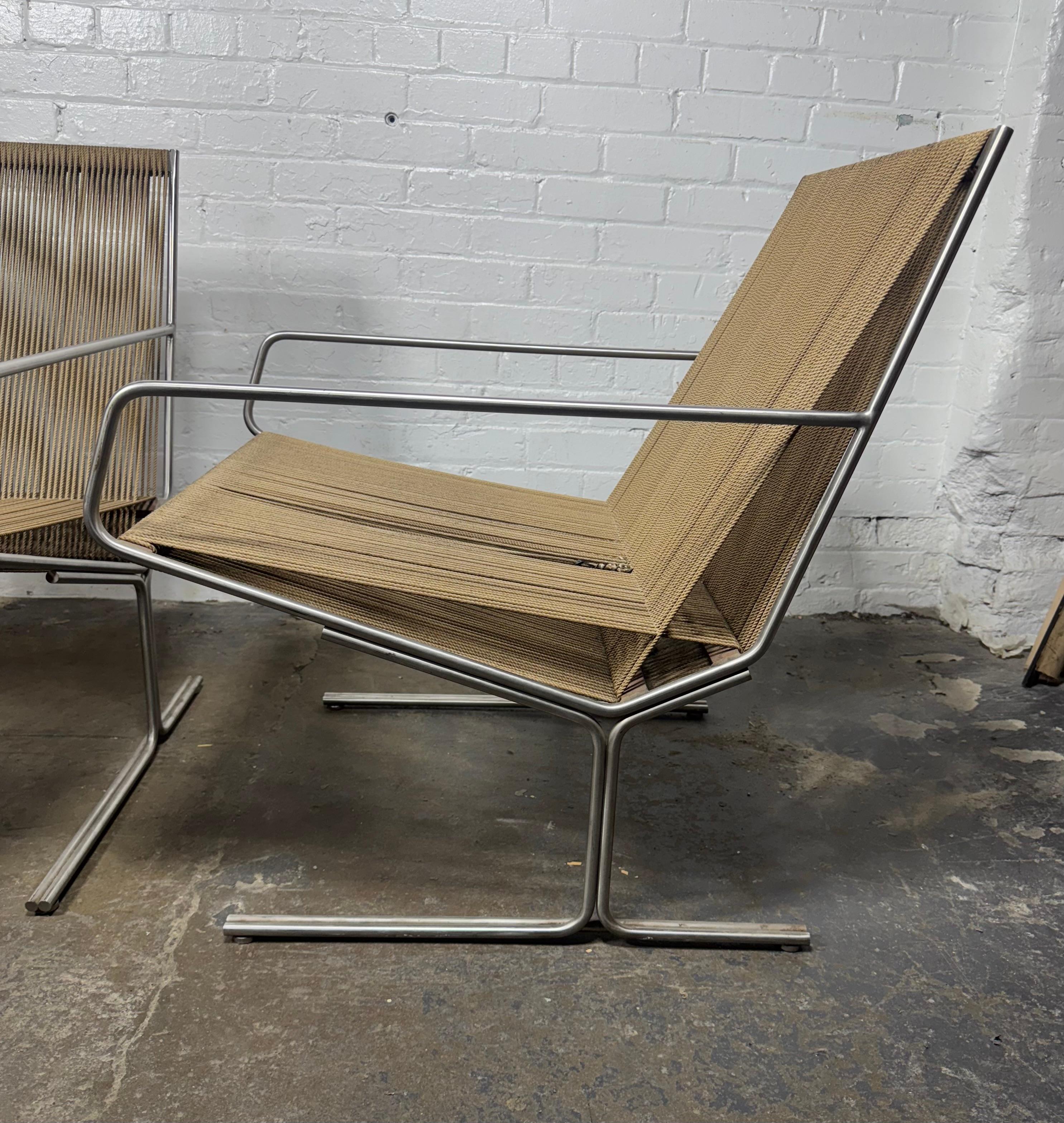 Pair Allan Gould All Original Low String Arm Chairs / architectual modernist.. Chromed steel frames.. Amazing design. Extremely comfortable.. some fabric string unraveling (see photos) Hand delivery avail to New York City or anywhere en route from