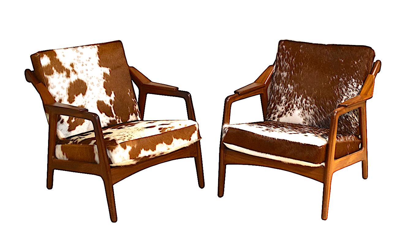 Pair of stunning armchairs by Danish designer H. Brockmann-Petersen covered in soft cowhide 
With slatted backs, low form, but very comfortable.