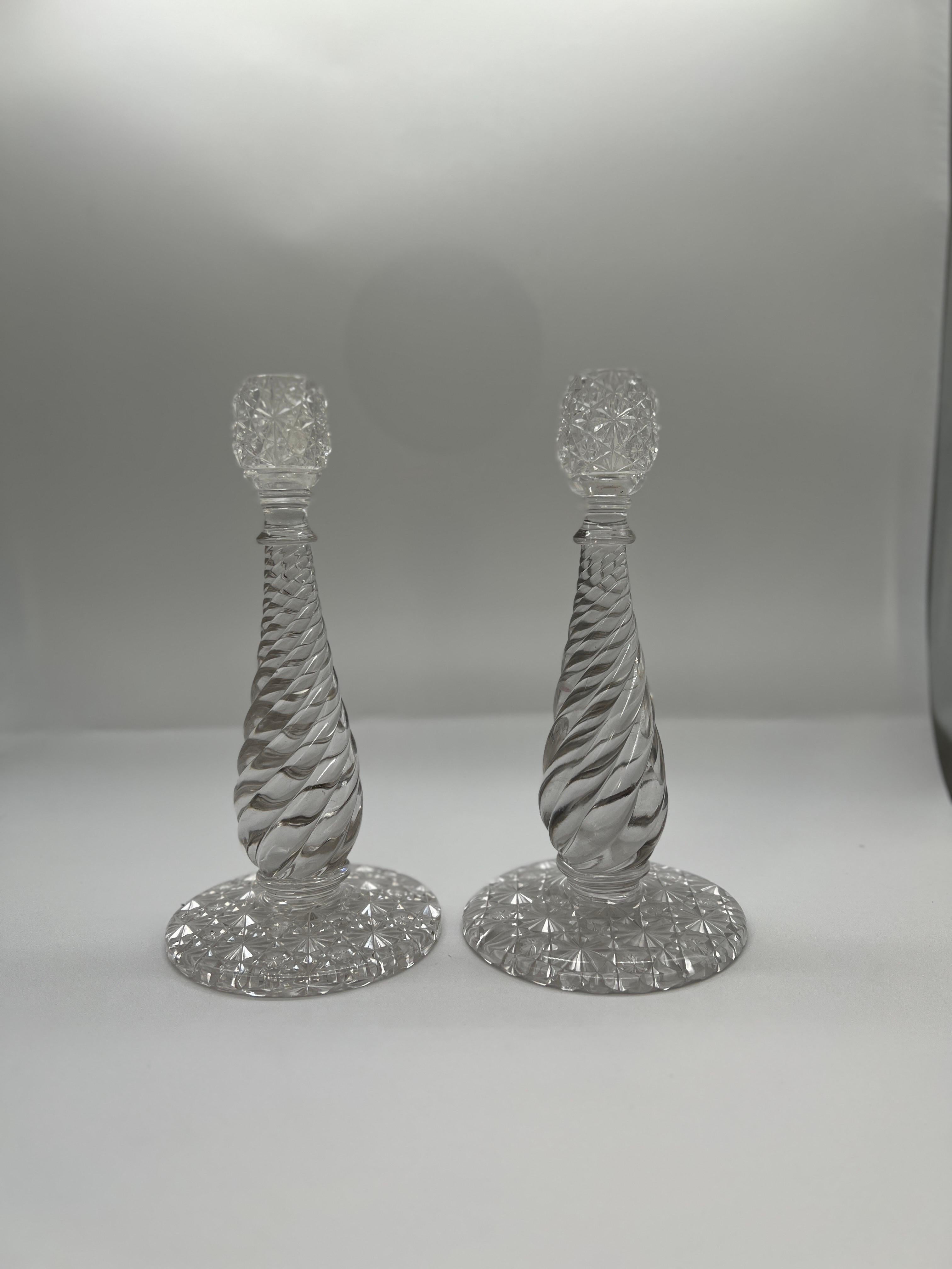 American, 19th century.

A pair of fine quality antique American Brilliant Period Cut Glass candlesticks in the RARE Russian and Swirl patterns. Each with an incredibly deep cut with stars and strawberry diamonds. 
Each accompanied with