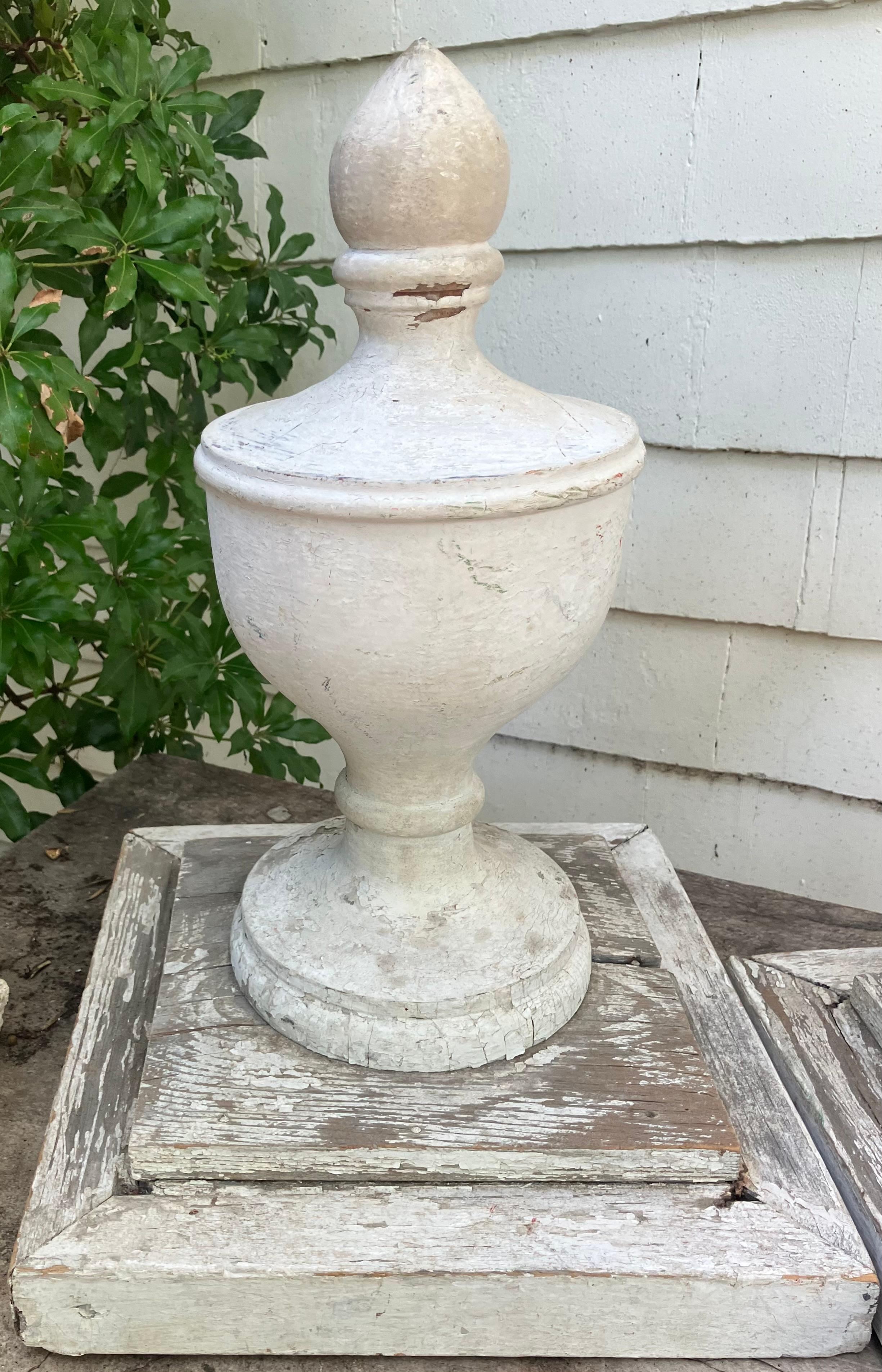 Pair American carved urn finials. Pair antique American carved and painted architectural wood finials of elegant urn form shape with knopf lids on original wood bases. United States, 1880’s 

Dimensions: 18 1/2” H x 7 3/4
