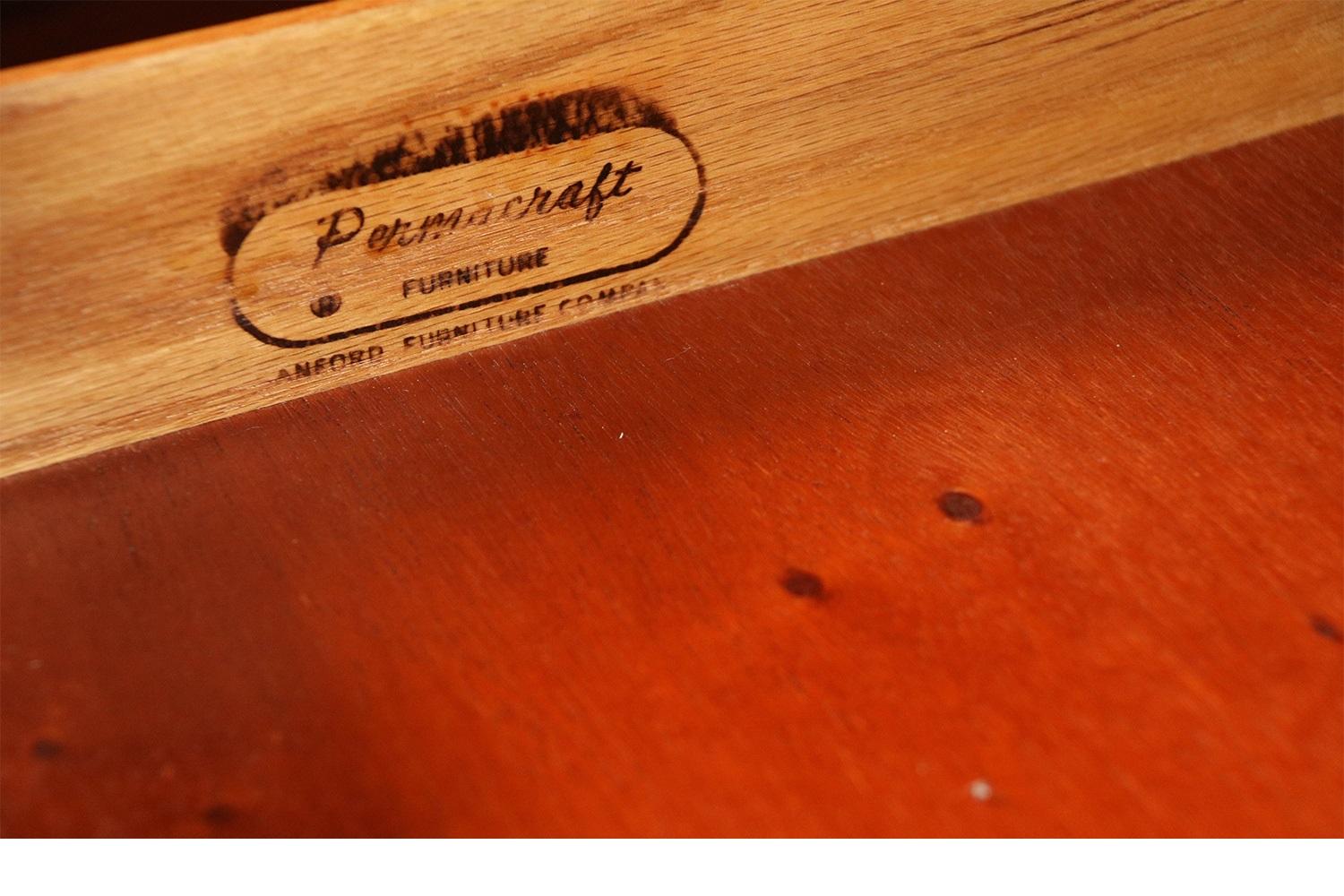 A pair of vintage Cherry Bachelor’s chests with four graduated drawers by Permacraft of Sanford Furniture Company of Sanford, North Carolina. A Classic set of Bachelor’s chests with a warm cherry patina feature four graduated drawers with dovetail