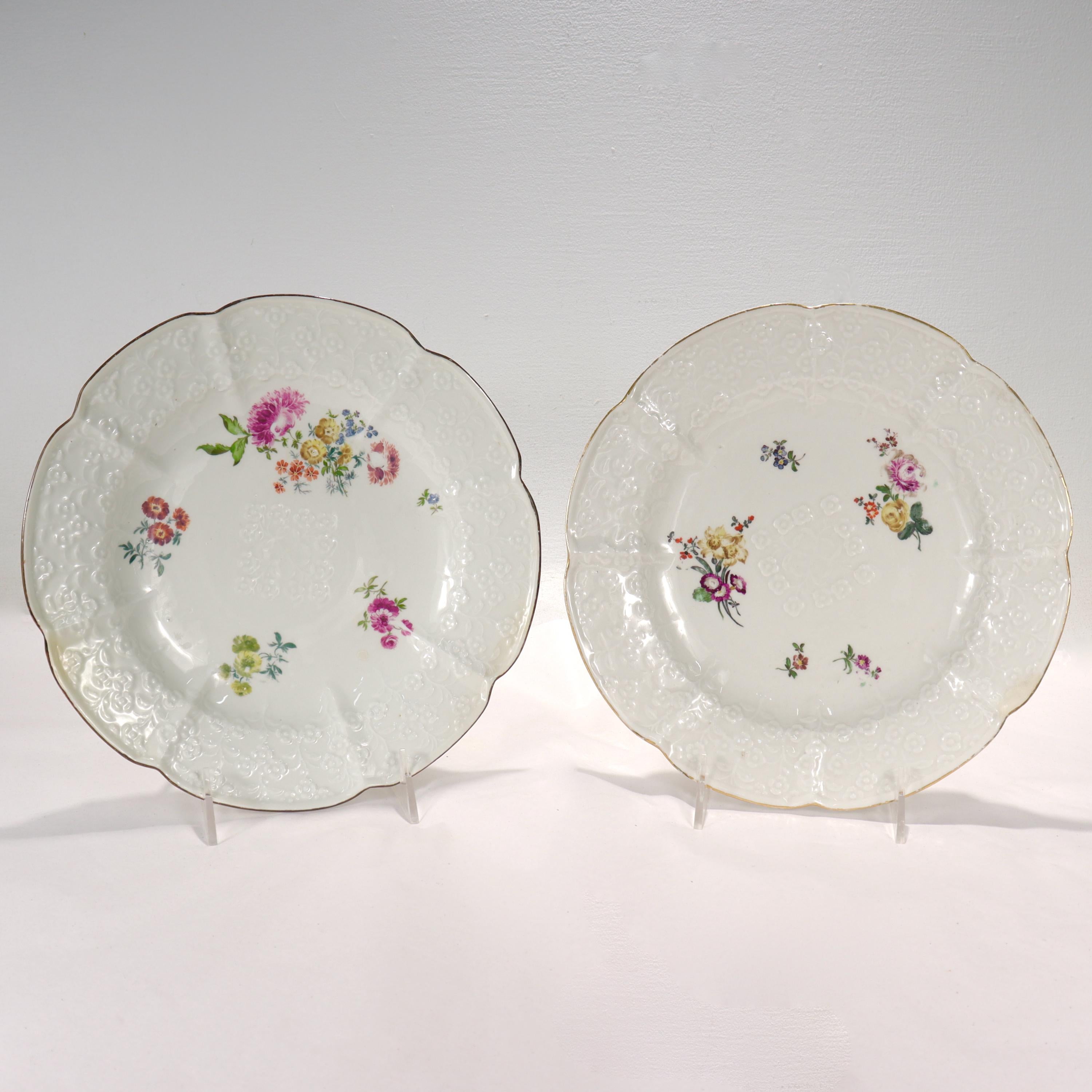 A fine pair of antique Vergiss Meinnicht (Forget-me-not) pattern plates.

By the Royal Meissen Porcelain Manufactory.

Decorated with Deutsche Blumen floral sprays to the center including various flowers & molded floral motif to the center. 

The