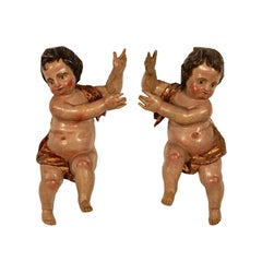 Coppia di statue di angeli putti antichi del XVIII secolo, barocco italiano, intagliati in policromia 1700