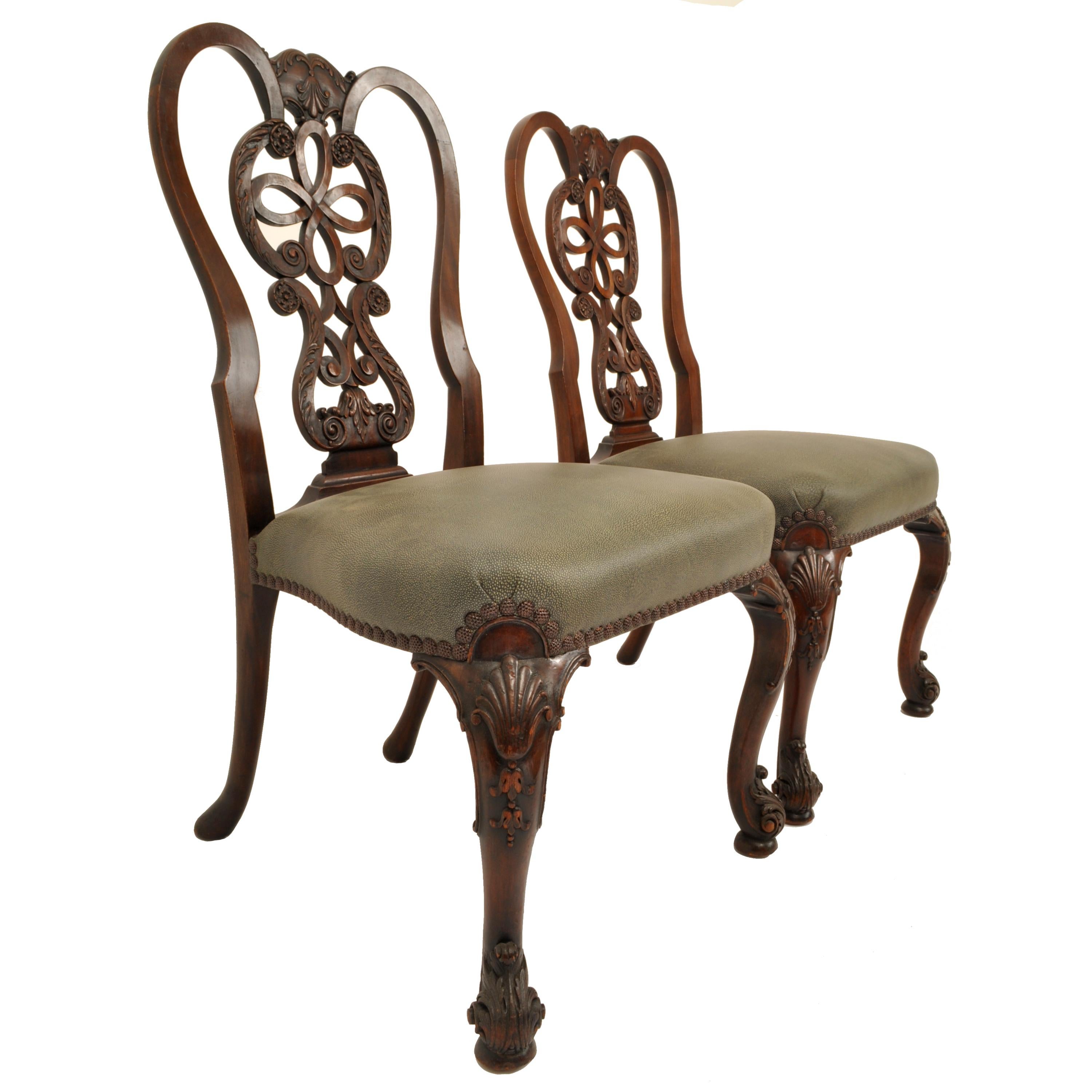 A very fine pair of antique 19th century carved mahogany Chippendale side chairs, circa 1880.
The chairs have just been professionally reupholstered with a very high quality grained leather, the backs plats finely carved with C and S scrolls and