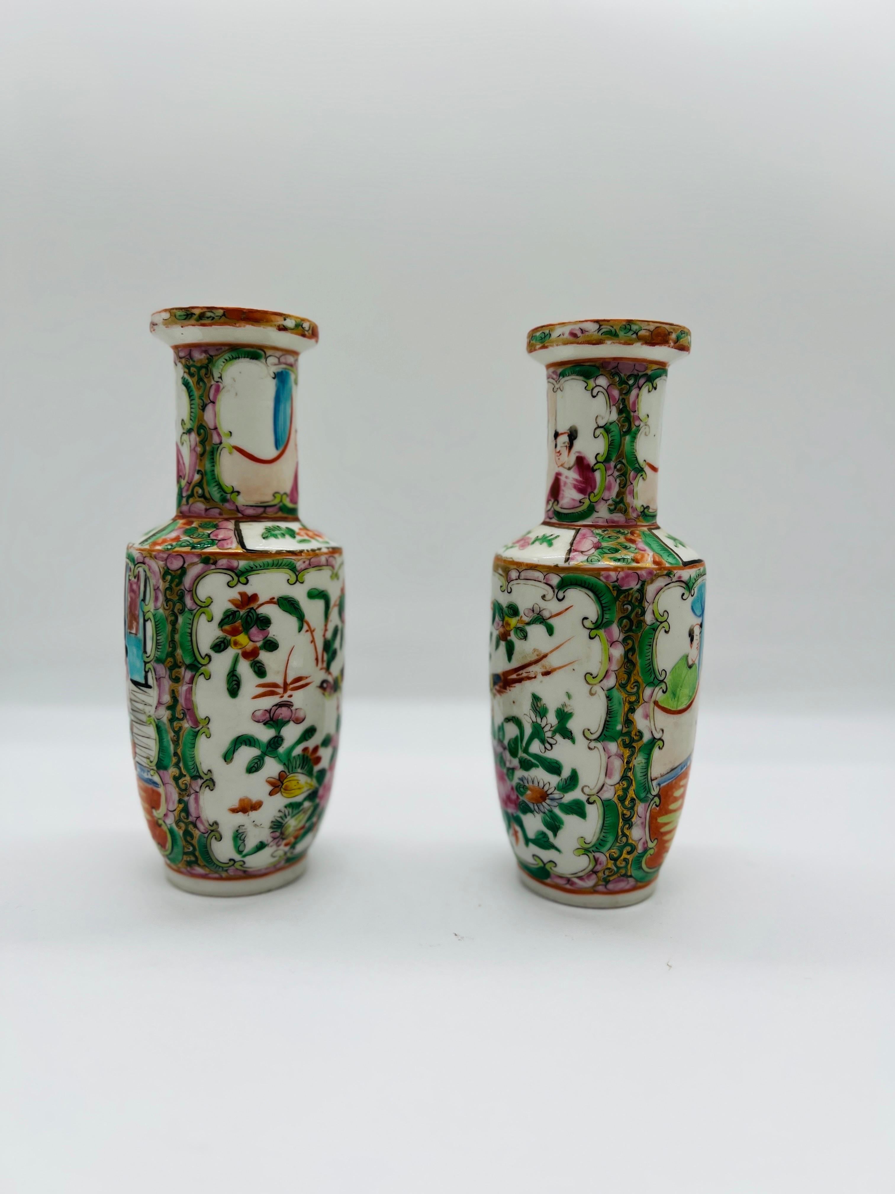 Chinese, 19th century.

A pair of antique 19th century Chinese vases decorated in the Famille Rose medallion pattern. Each vase has floral and bird motifs to one side and traditional guardian landscapes to the other. Unmarked to underside.