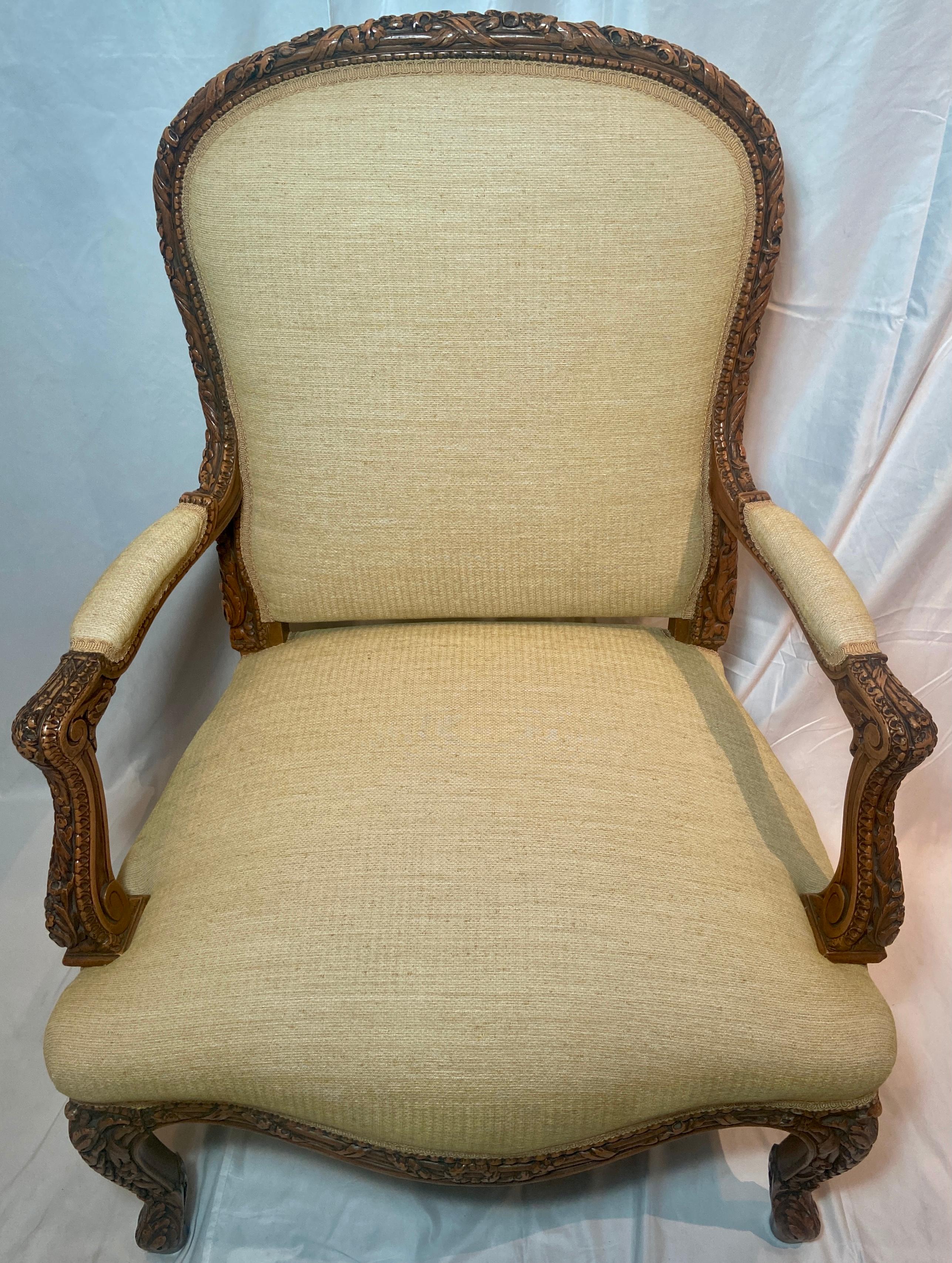 Pair antique 19th century French finely carved arm chairs with light yellow upholstery, Circa 1890.