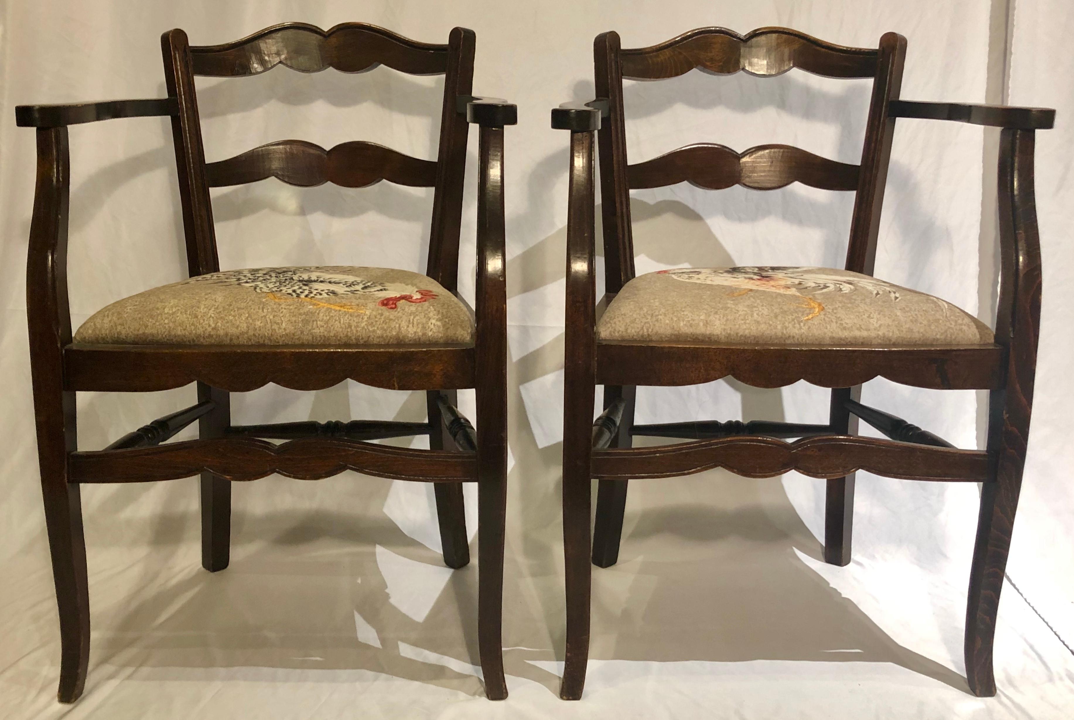 Pair antique 19th century French Country armchairs with rooster themed upholstery, Circa 1890.