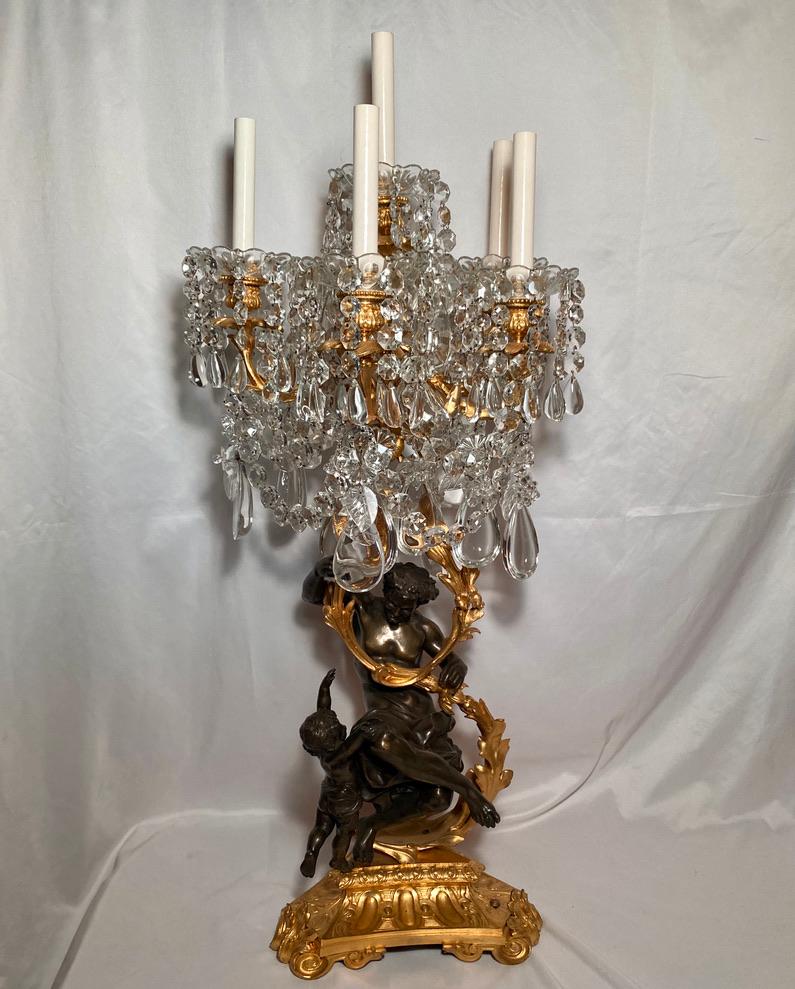Pair magnificent antique early 19th century French crystal, ormolu and patented bronze figural candelabra.
 